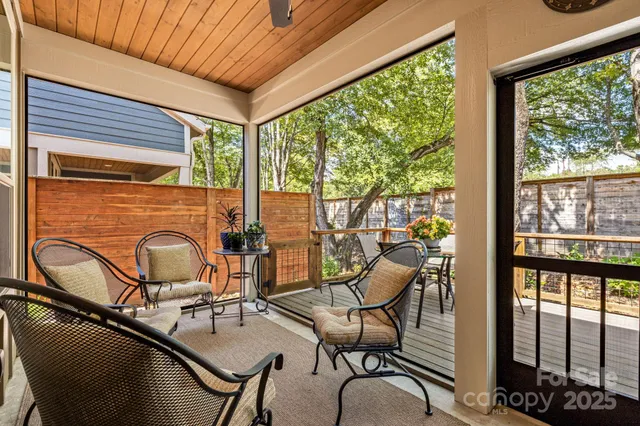 a room with glass door and furniture