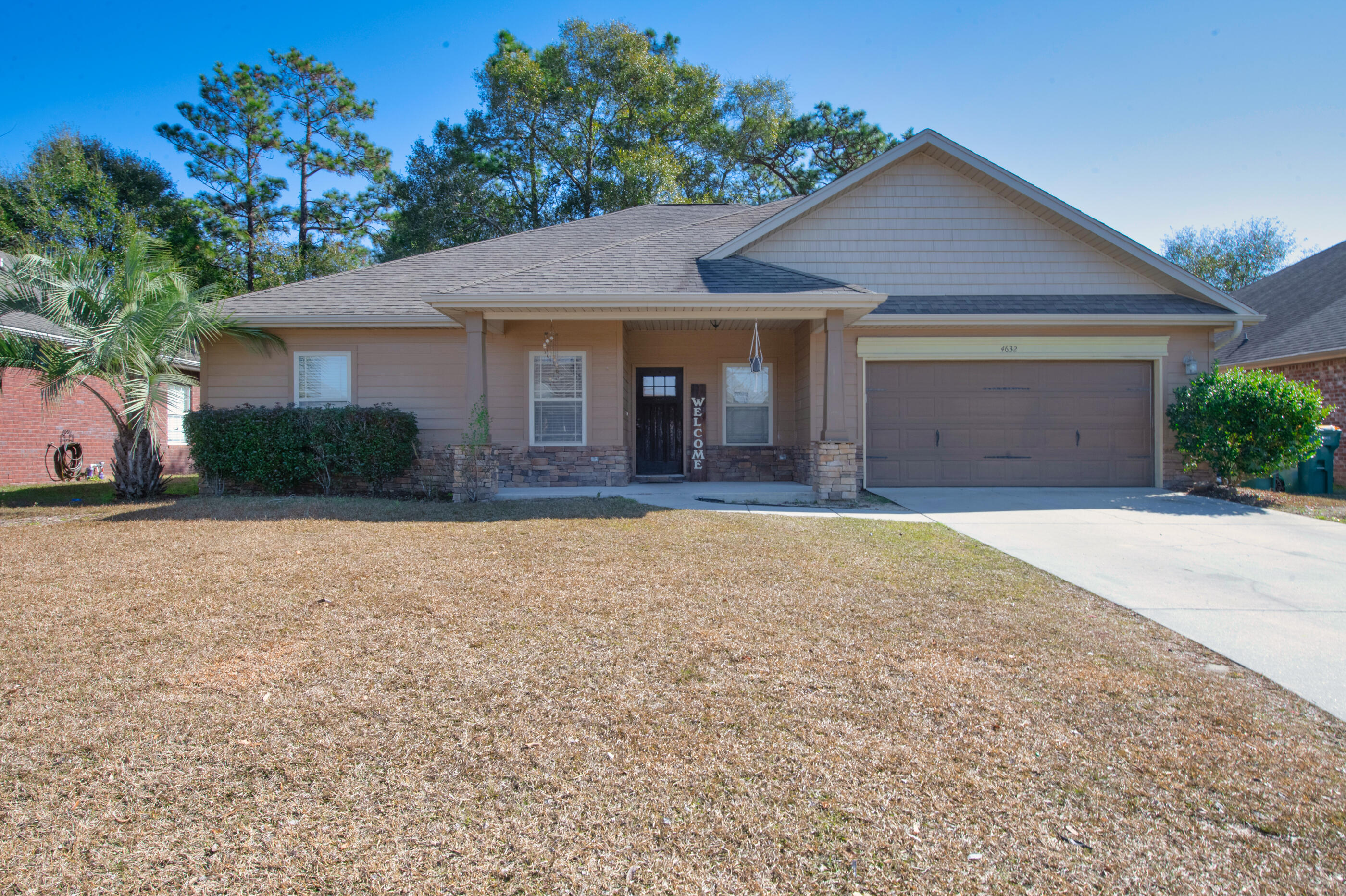front view of a house with a yard
