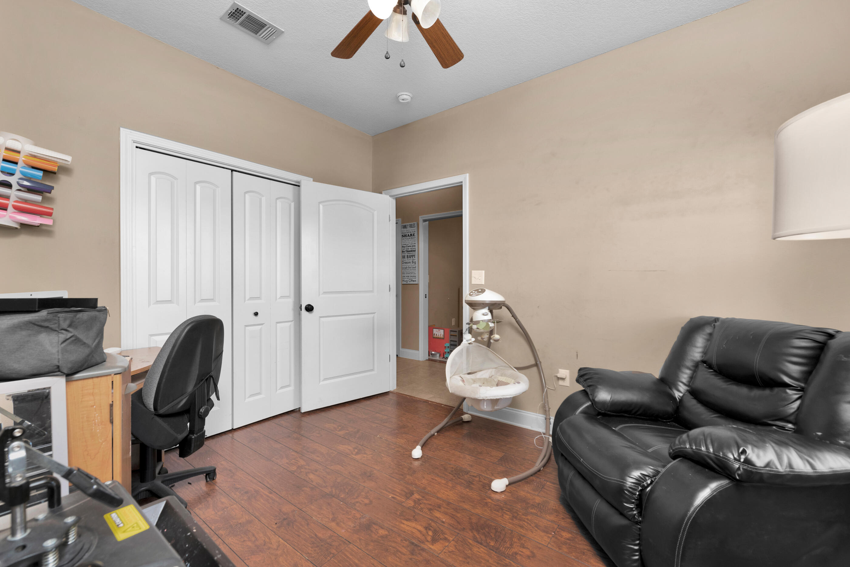 4632 Hermosa Road Crestview, FL 32539 - Photo 12 of 22 a living room with furniture and a chair