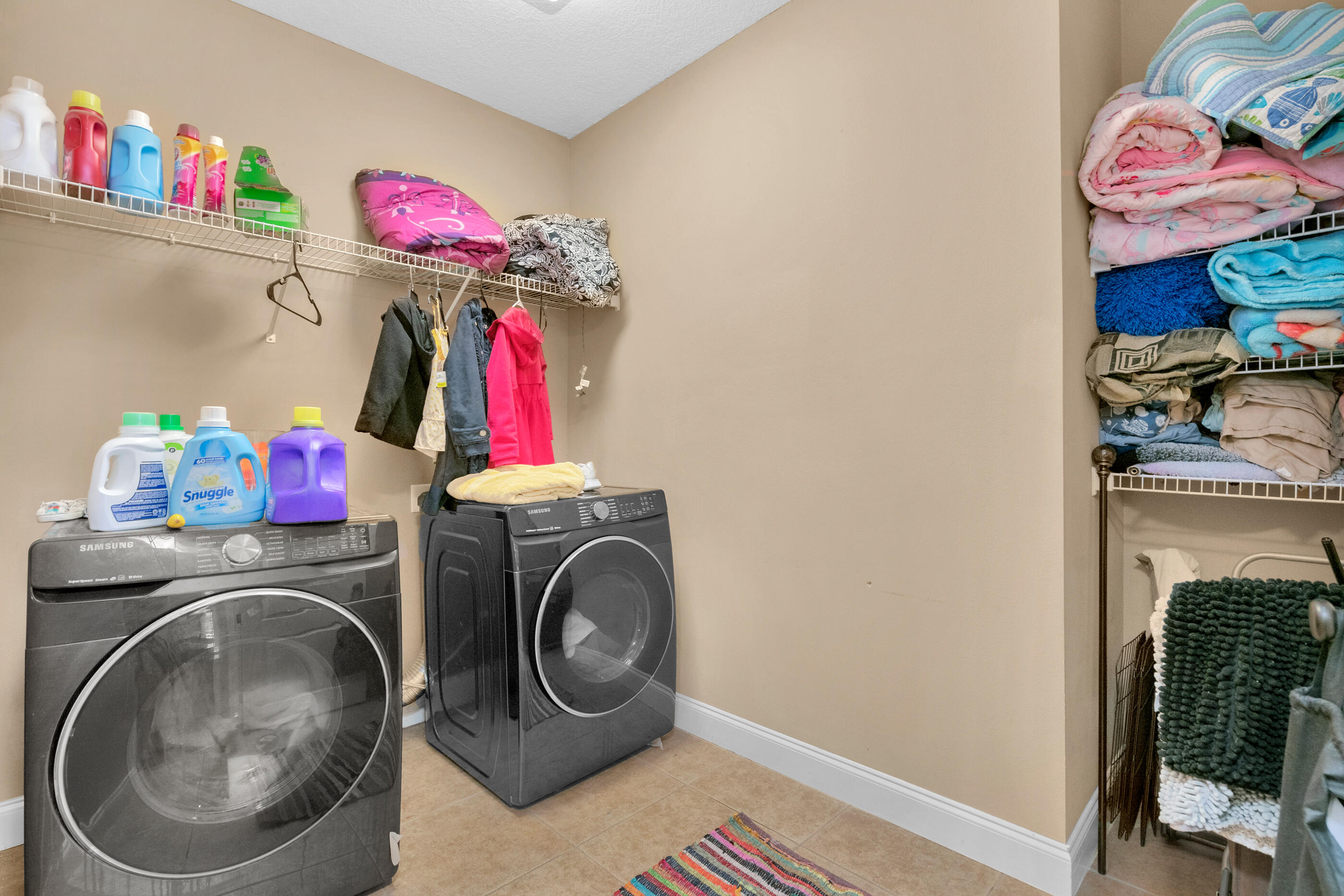 4632 Hermosa Road Crestview, FL 32539 - Photo 16 of 22 a view of storage and utility room with washer and dryer