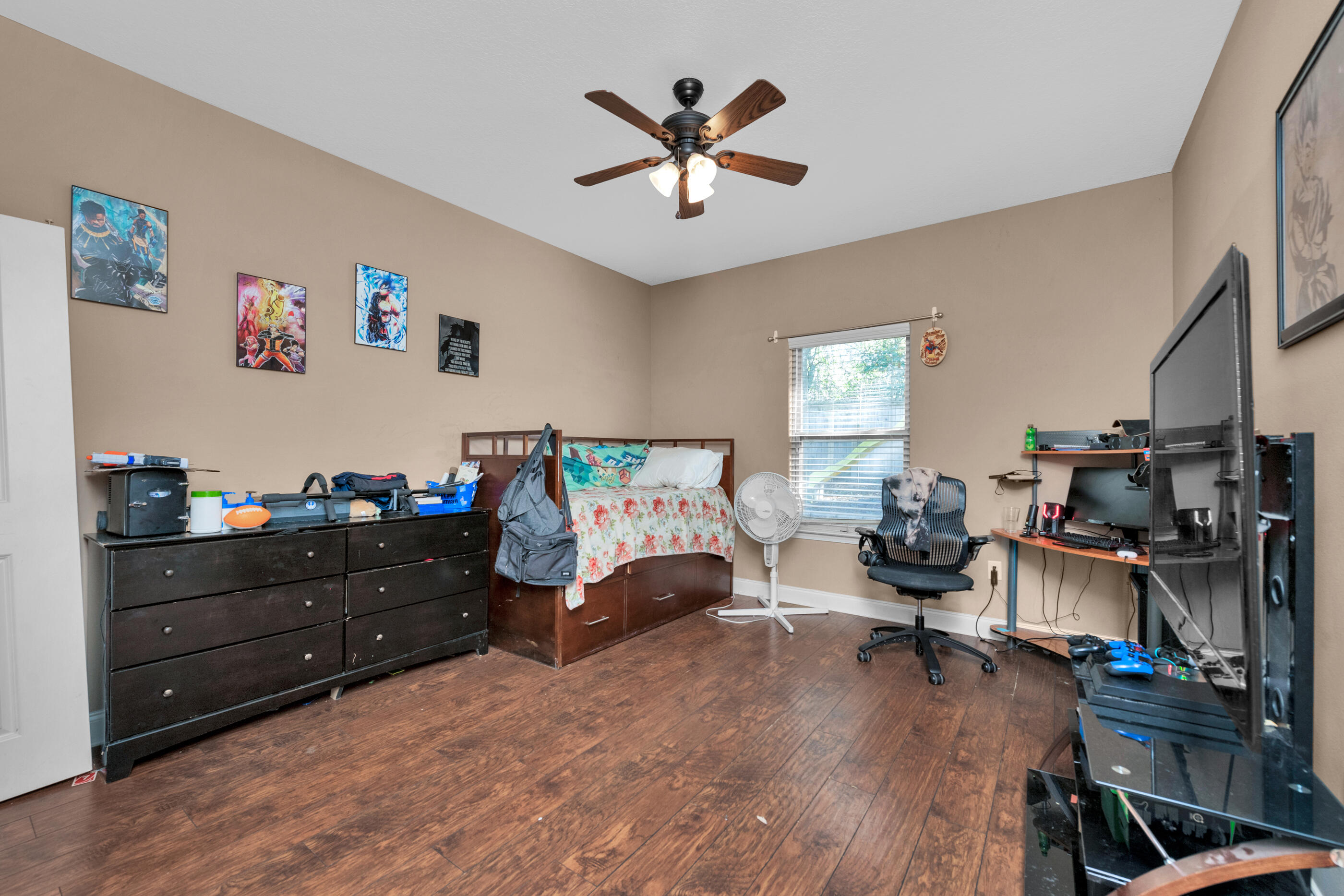 4632 Hermosa Road Crestview, FL 32539 - Photo 19 of 22 a living room with furniture and wooden floor