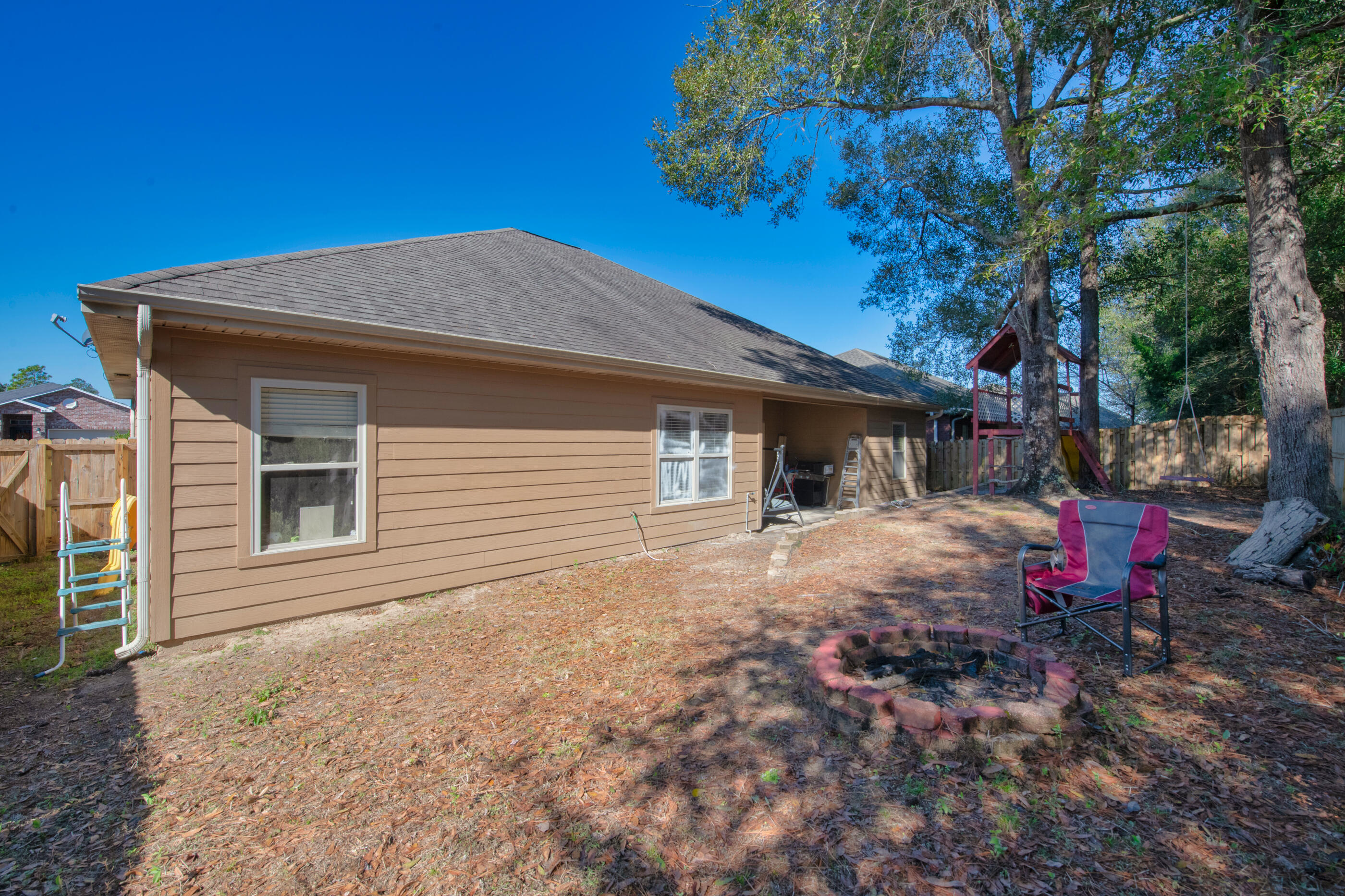 4632 Hermosa Road Crestview, FL 32539 - Photo 20 of 22 a view of a house with a yard