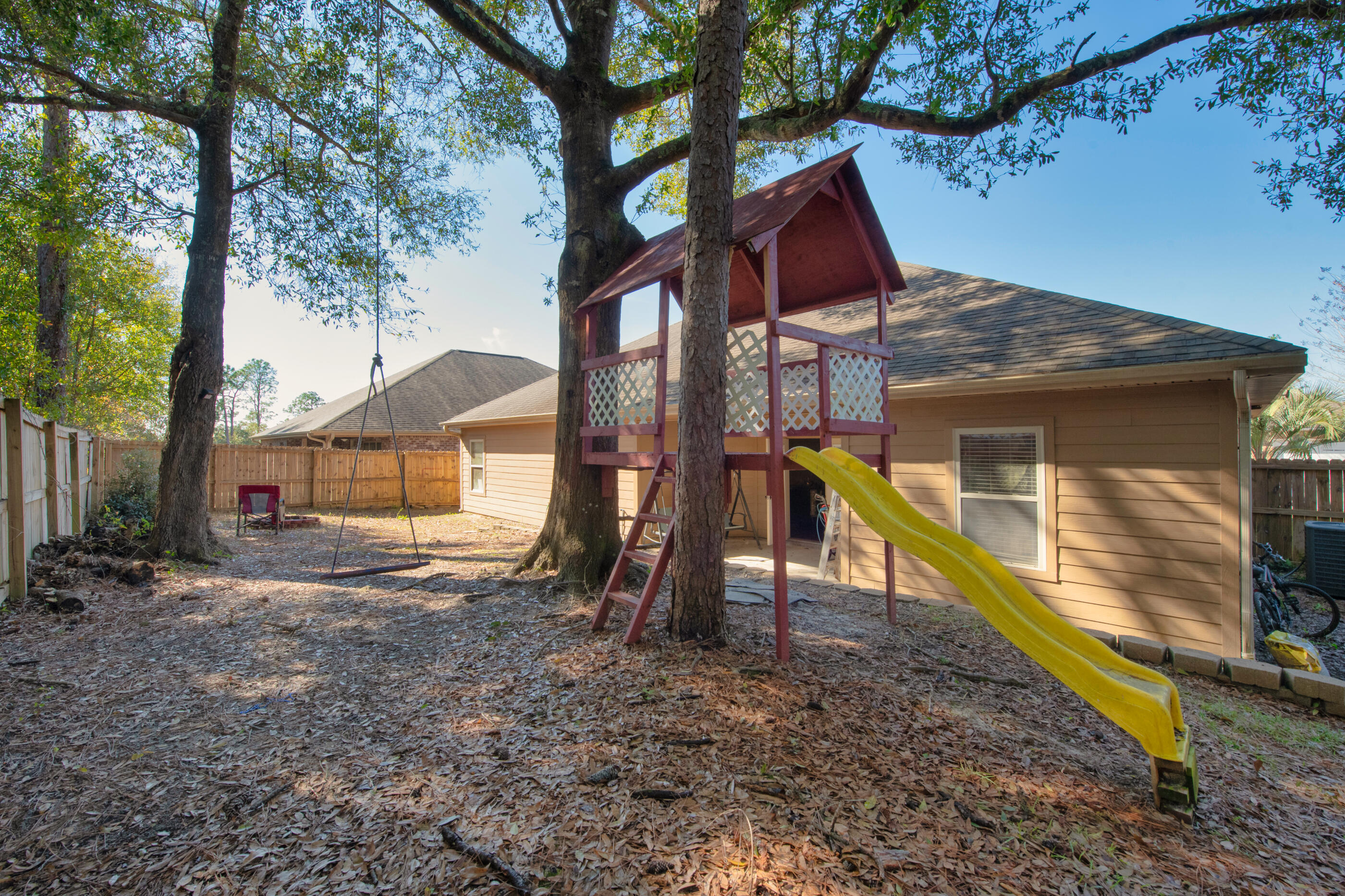 4632 Hermosa Road Crestview, FL 32539 - Photo 21 of 22 a view of house with a yard and the trees