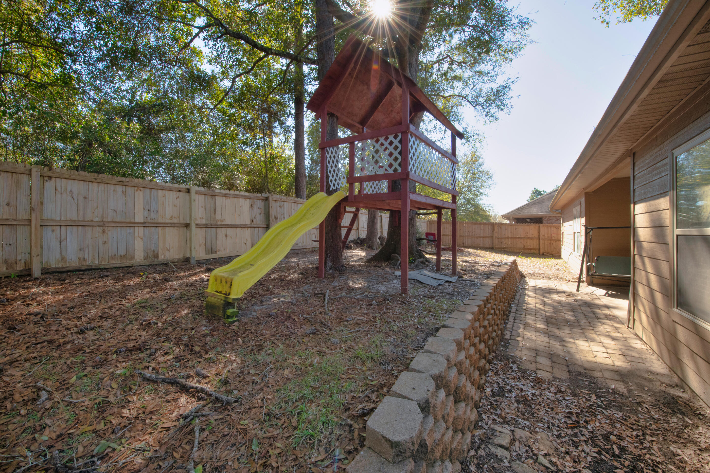 4632 Hermosa Road Crestview, FL 32539 - Photo 22 of 22 a view of a yard with a slide