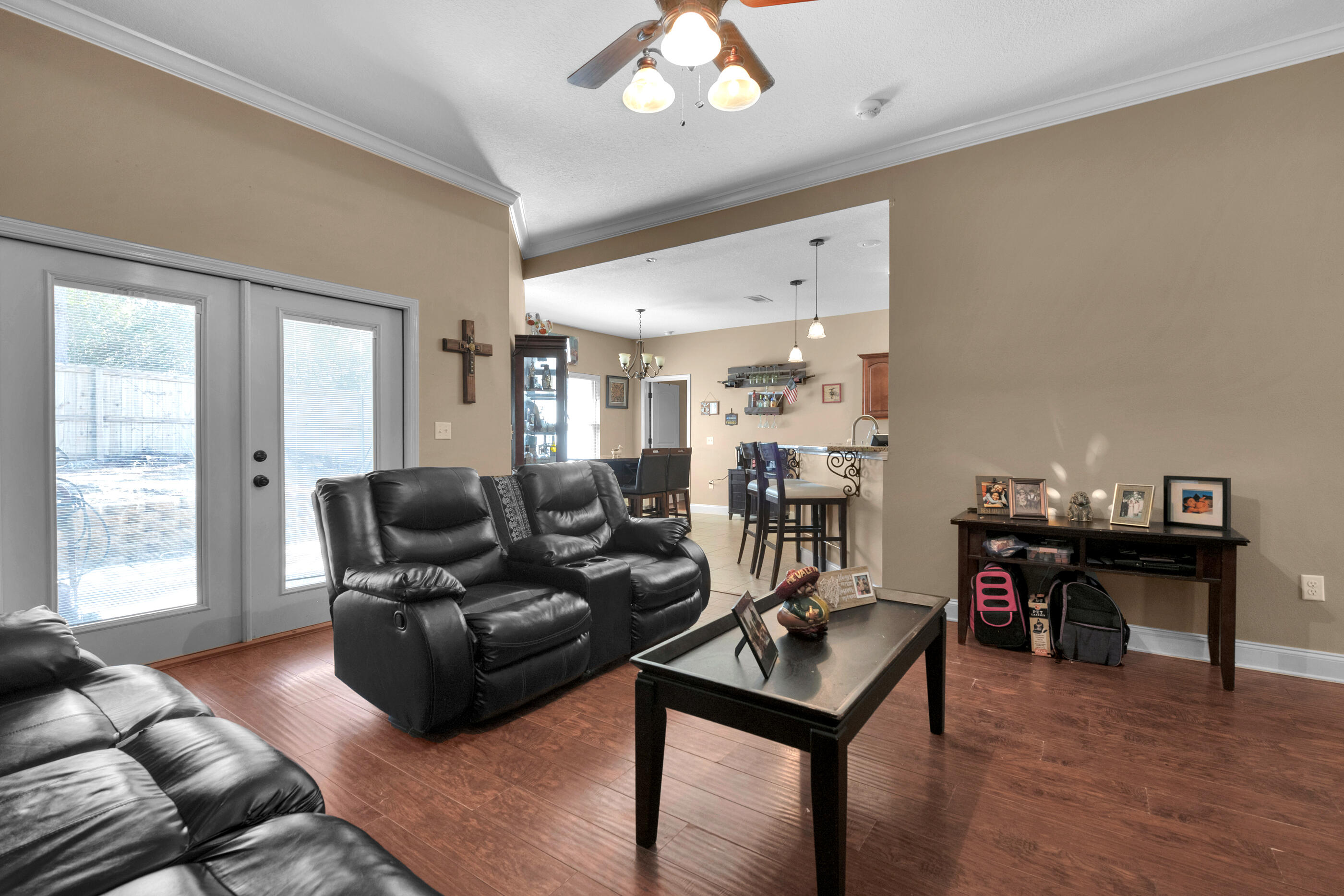 4632 Hermosa Road Crestview, FL 32539 - Photo 3 of 22 a living room with furniture a dining table and a piano table