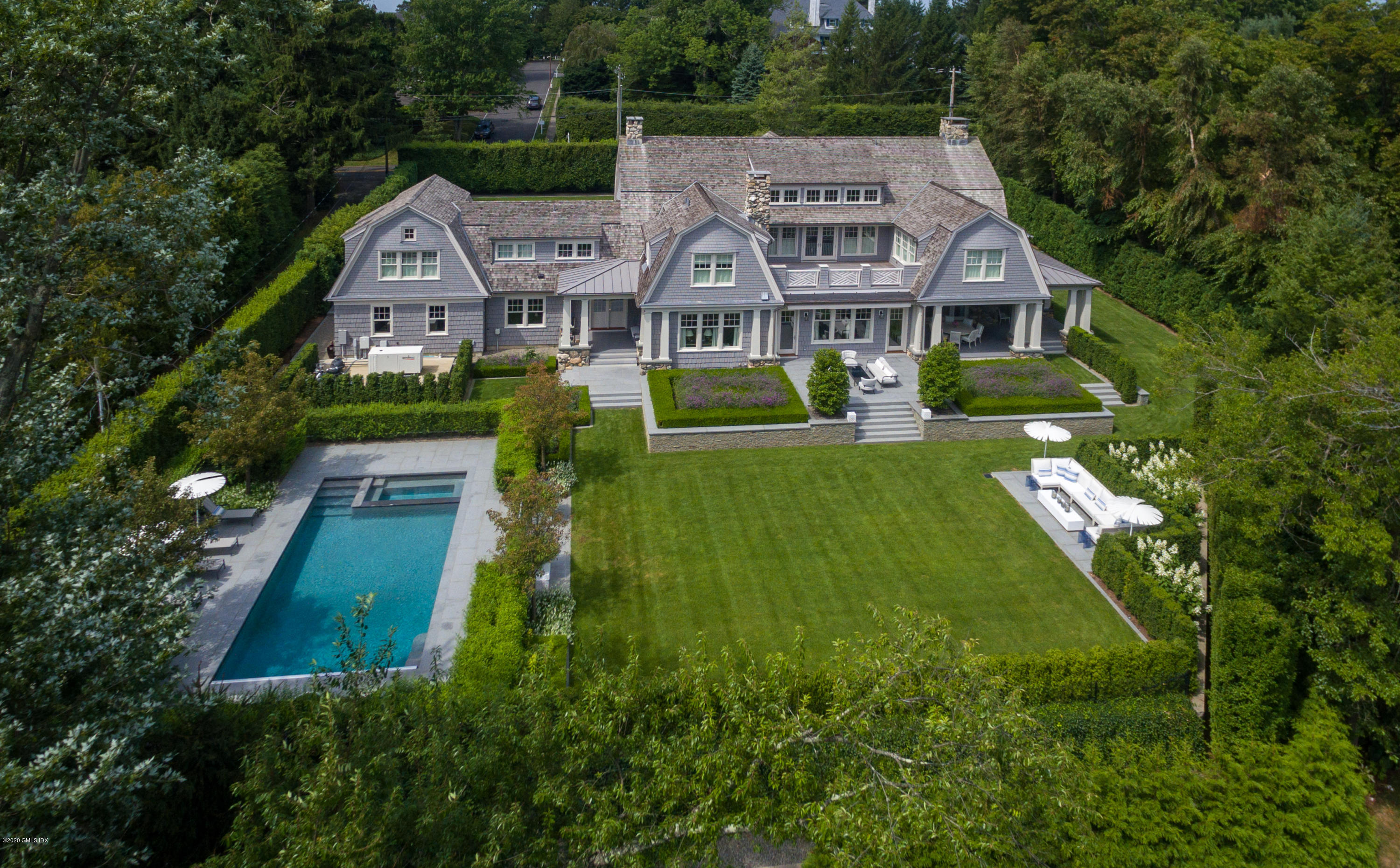 Undisclosed Address Greenwich, CT 06830 - Photo 1 of 30 a aerial view of a house with a big yard