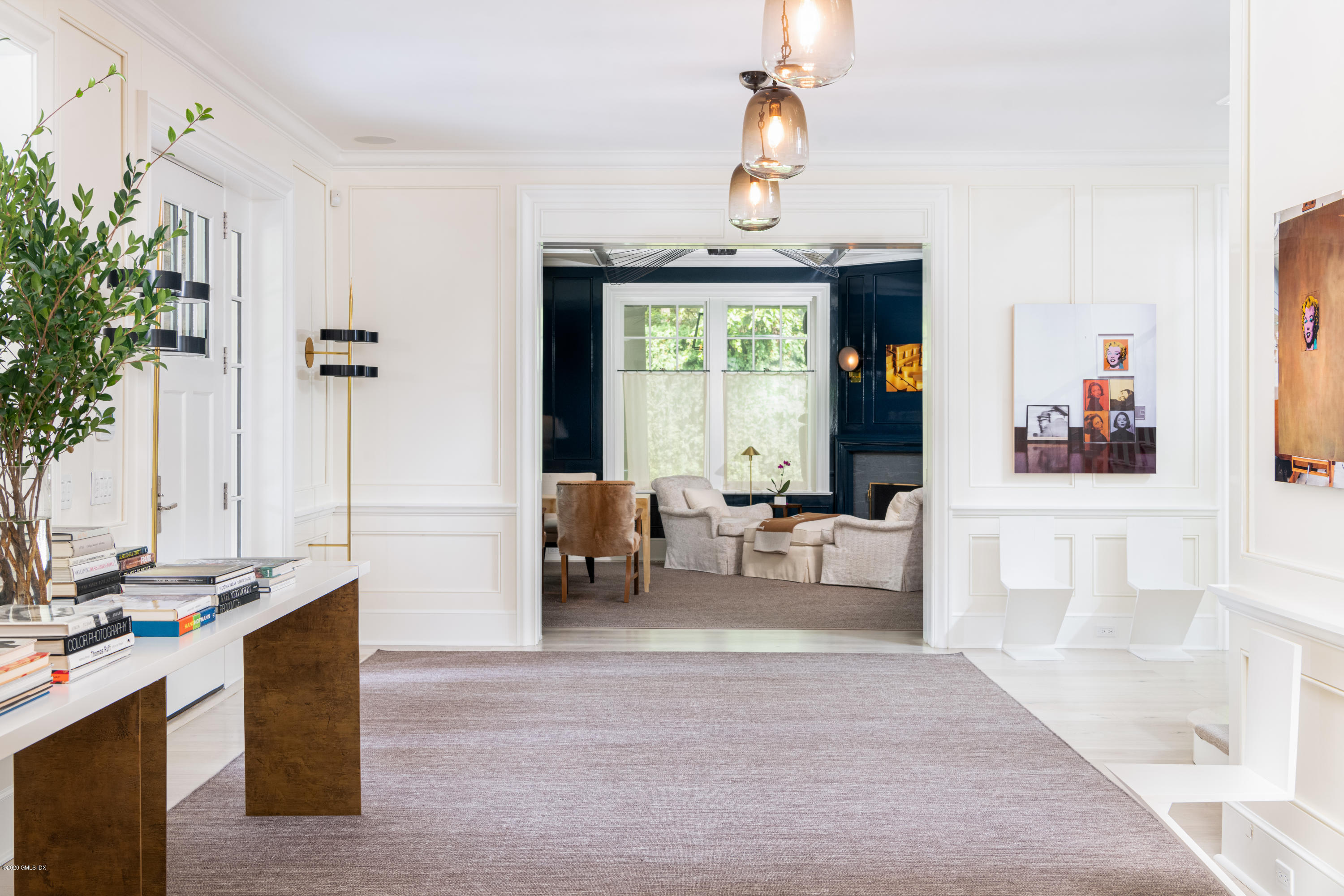 Undisclosed Address Greenwich, CT 06830 - Photo 11 of 30 a living room with furniture and a chandelier