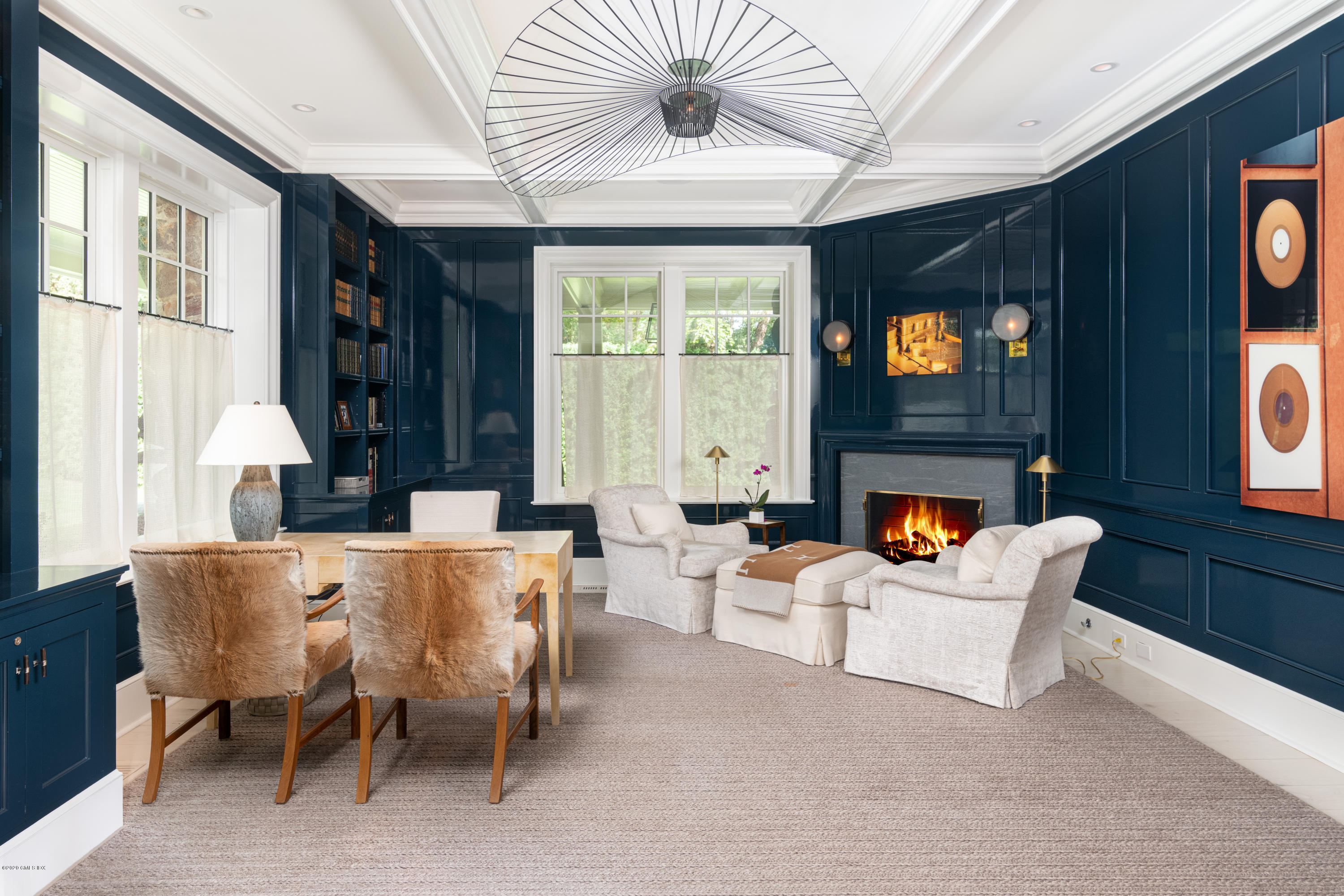 Undisclosed Address Greenwich, CT 06830 - Photo 12 of 30 a living room with furniture a fireplace and a flat screen tv