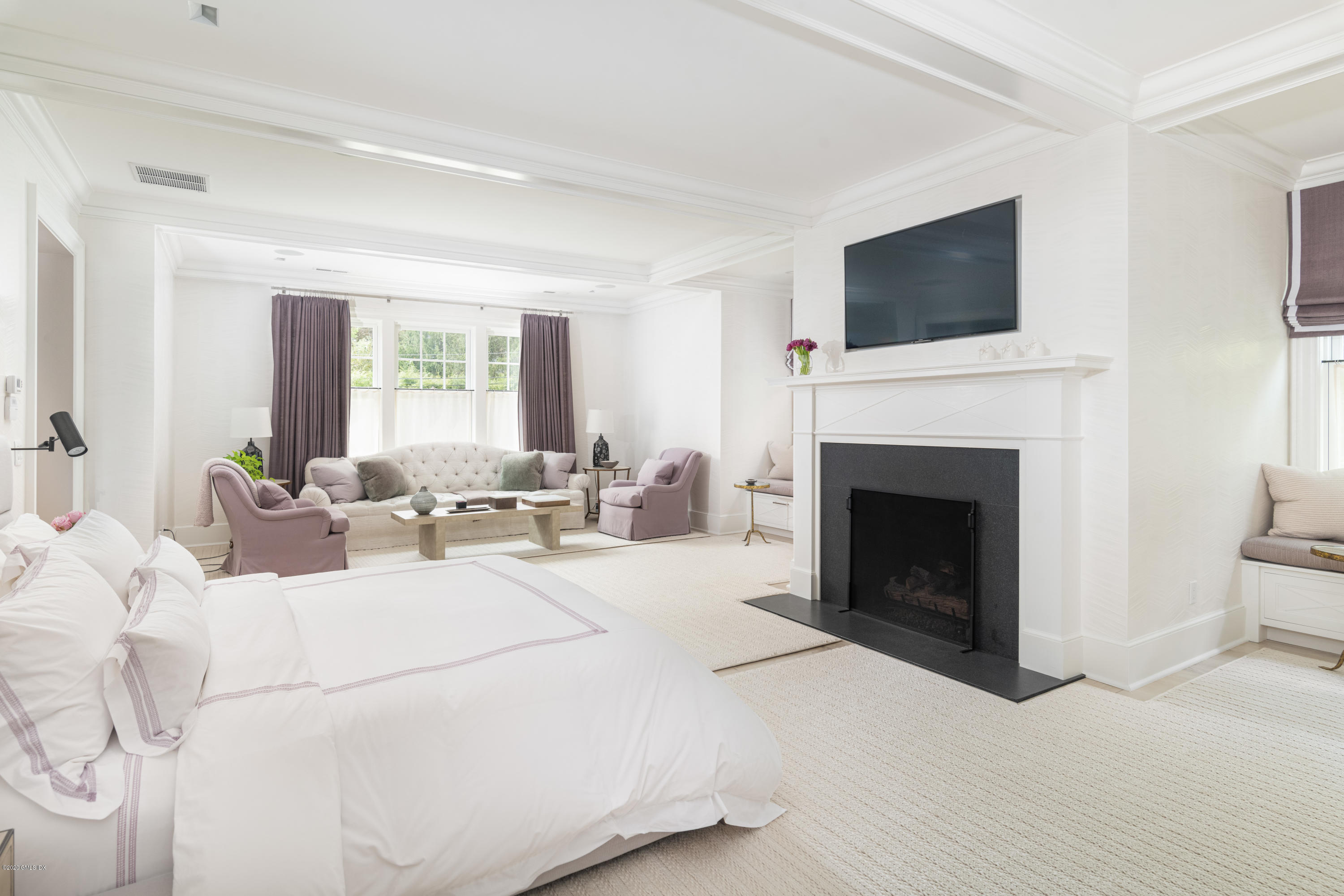 Undisclosed Address Greenwich, CT 06830 - Photo 14 of 30 a living room with furniture a flat screen tv and a fireplace