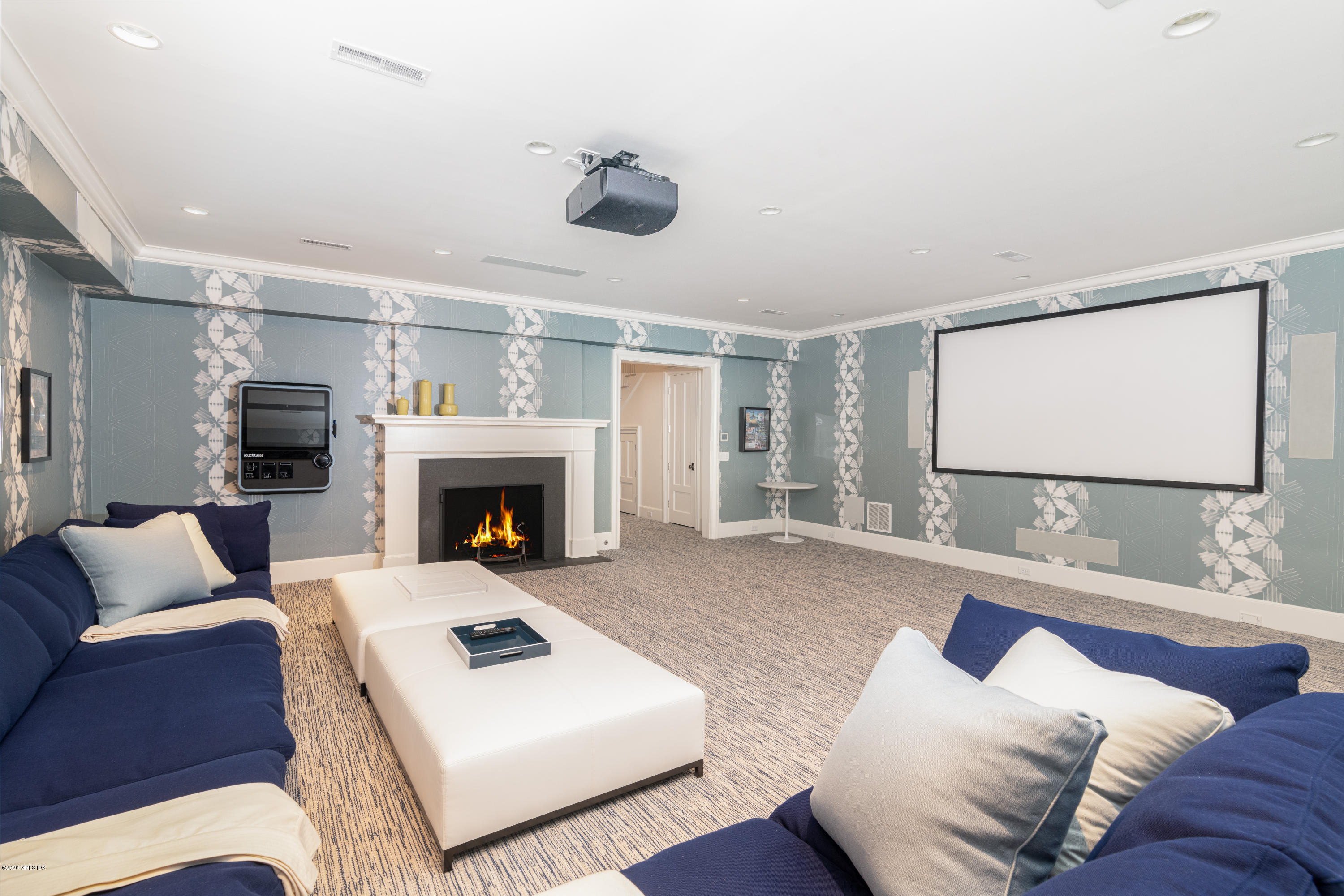 Undisclosed Address Greenwich, CT 06830 - Photo 19 of 30 a living room with furniture and a fireplace