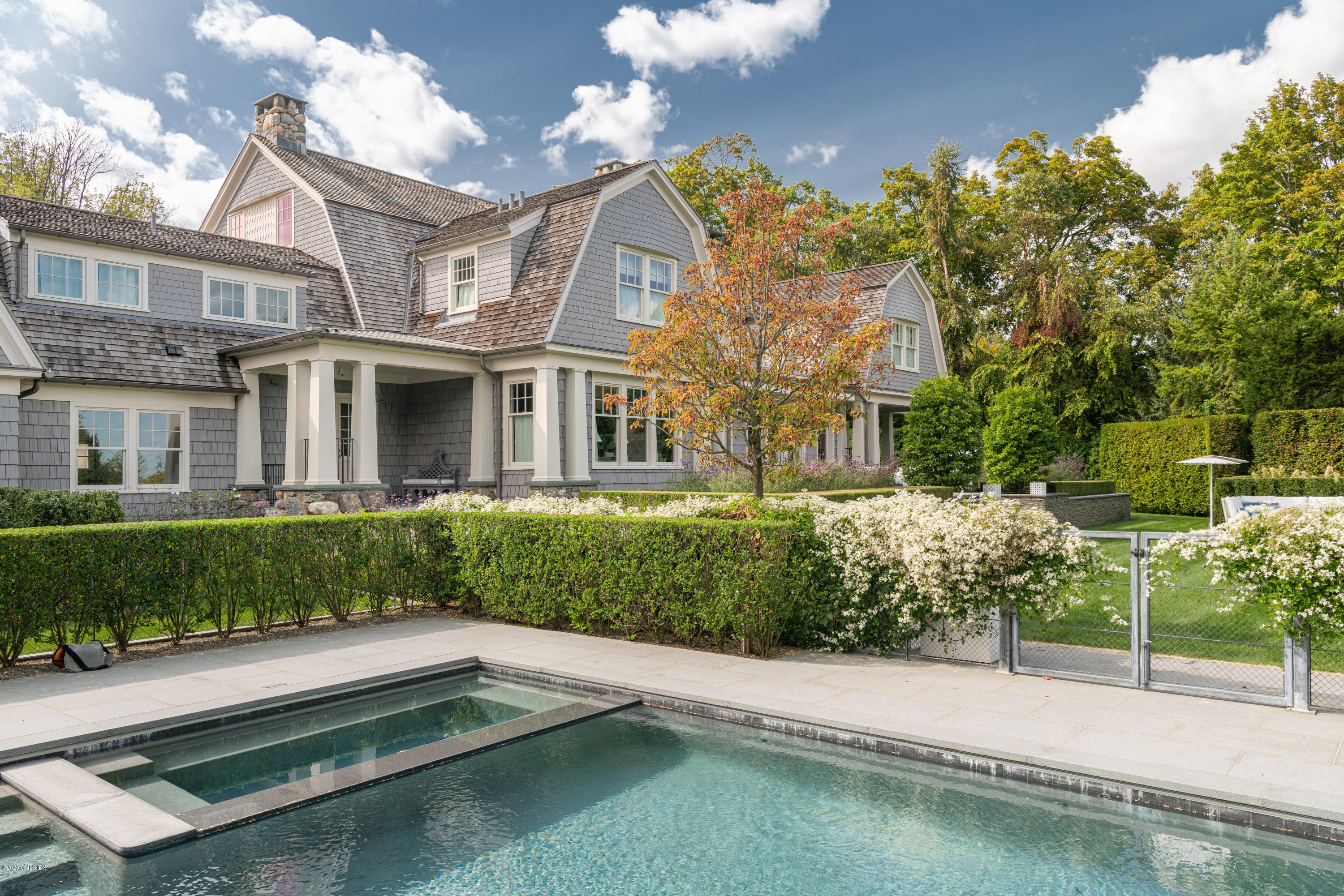 Undisclosed Address Greenwich, CT 06830 - Photo 25 of 30 a front view of a house with a yard