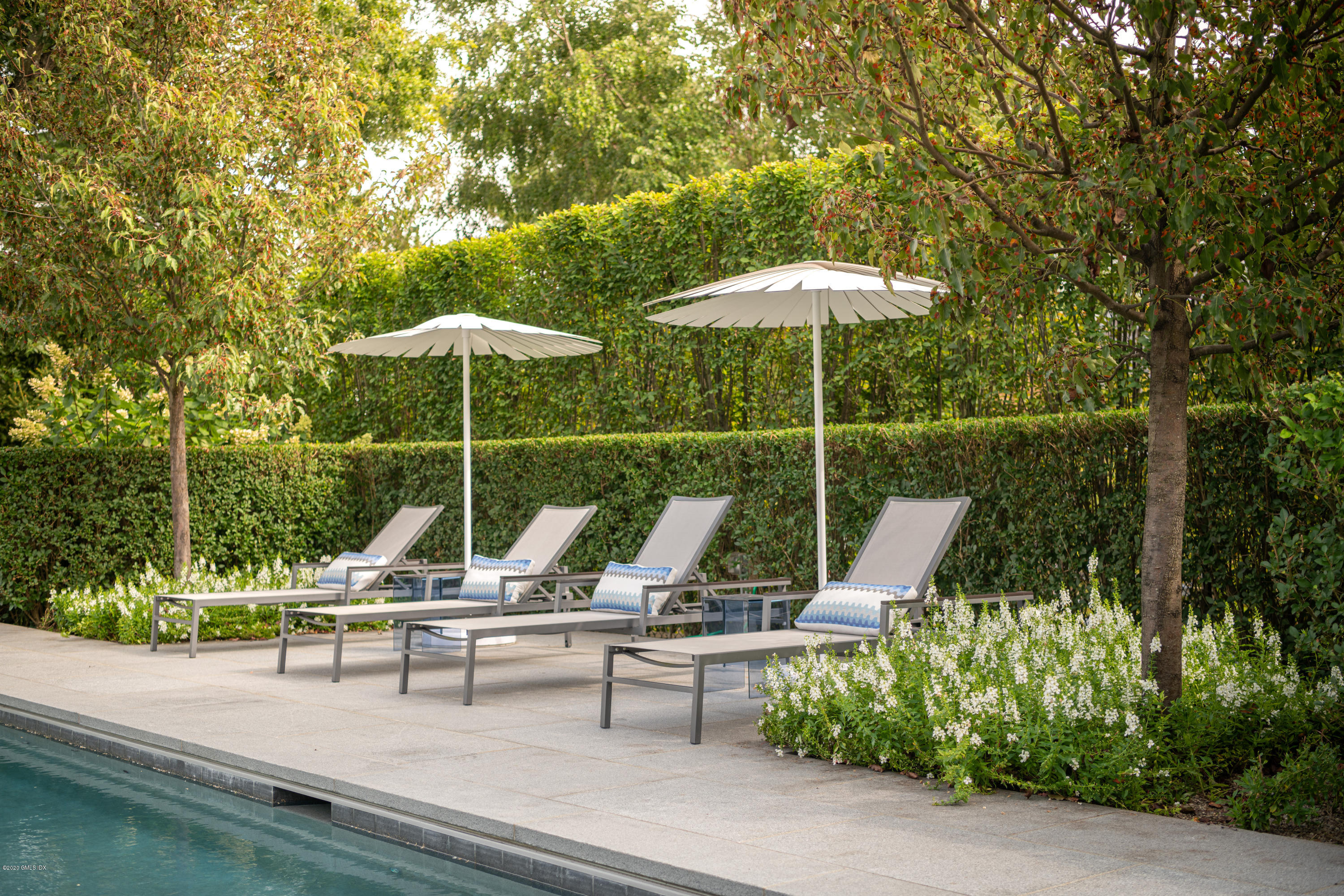 Undisclosed Address Greenwich, CT 06830 - Photo 26 of 30 a view of outdoor space with swimming pool and sitting area