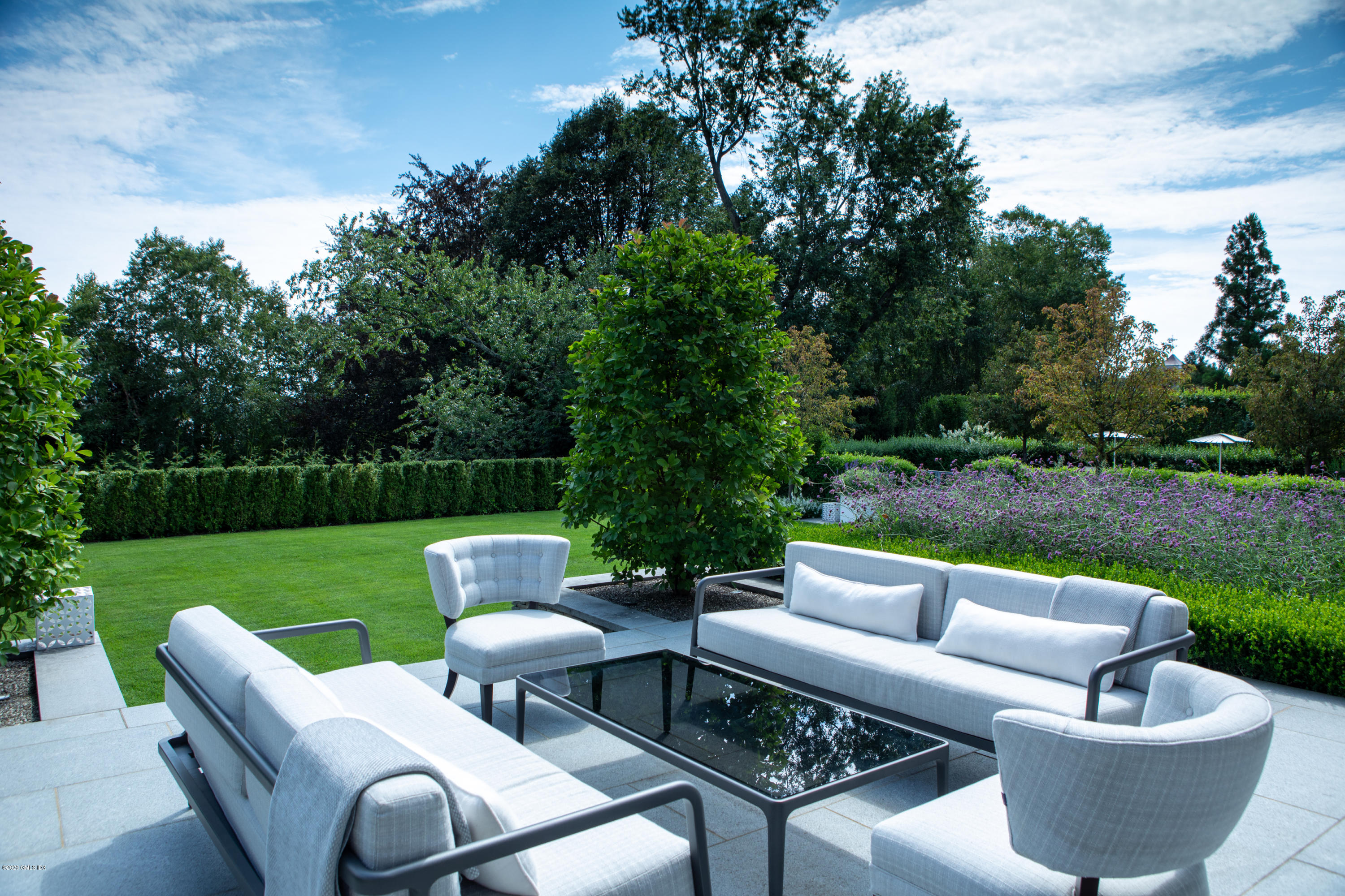 Undisclosed Address Greenwich, CT 06830 - Photo 28 of 30 a view of a patio with couches chairs and a yard