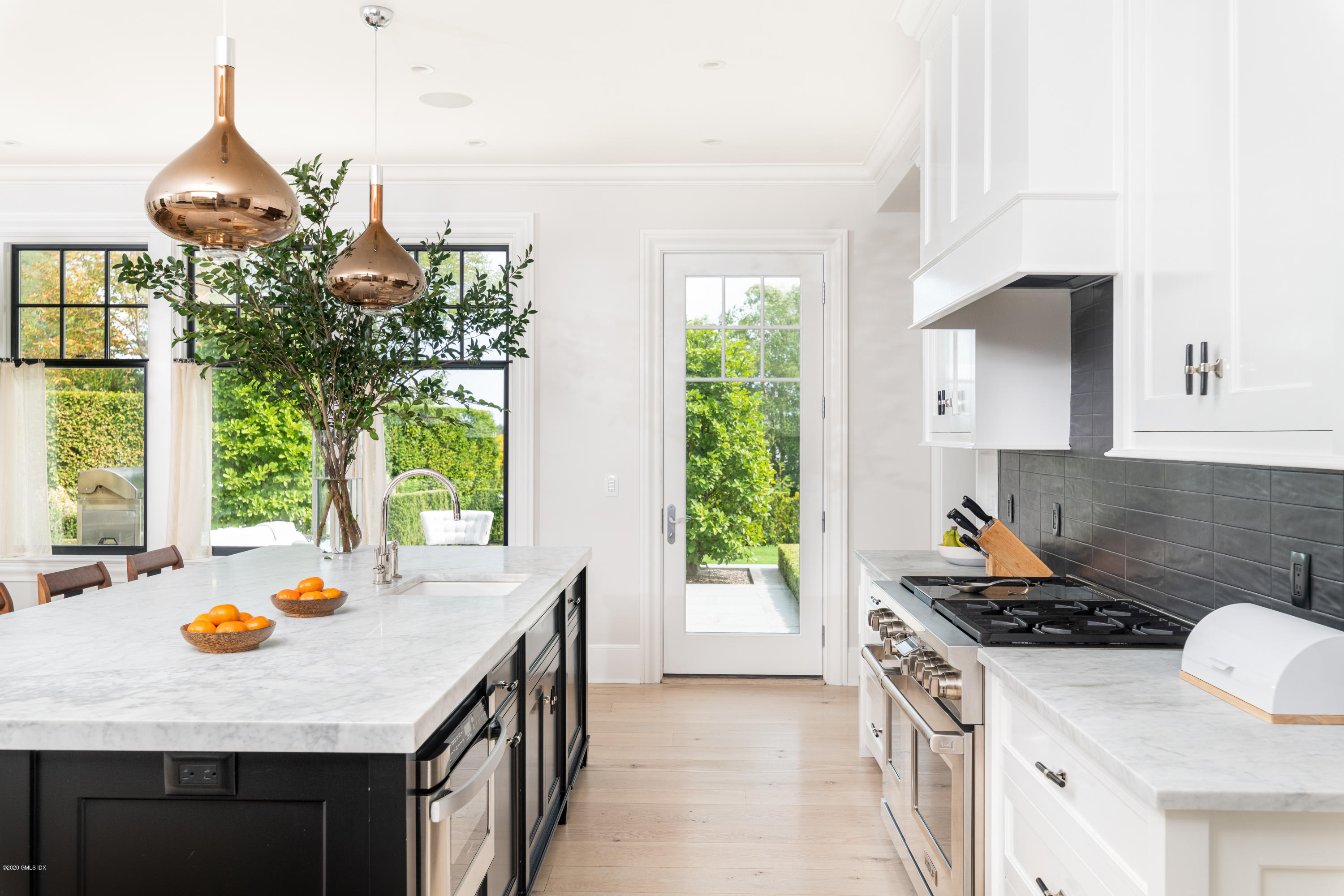 Undisclosed Address Greenwich, CT 06830 - Photo 6 of 30 a kitchen that has a stove and a wooden floor