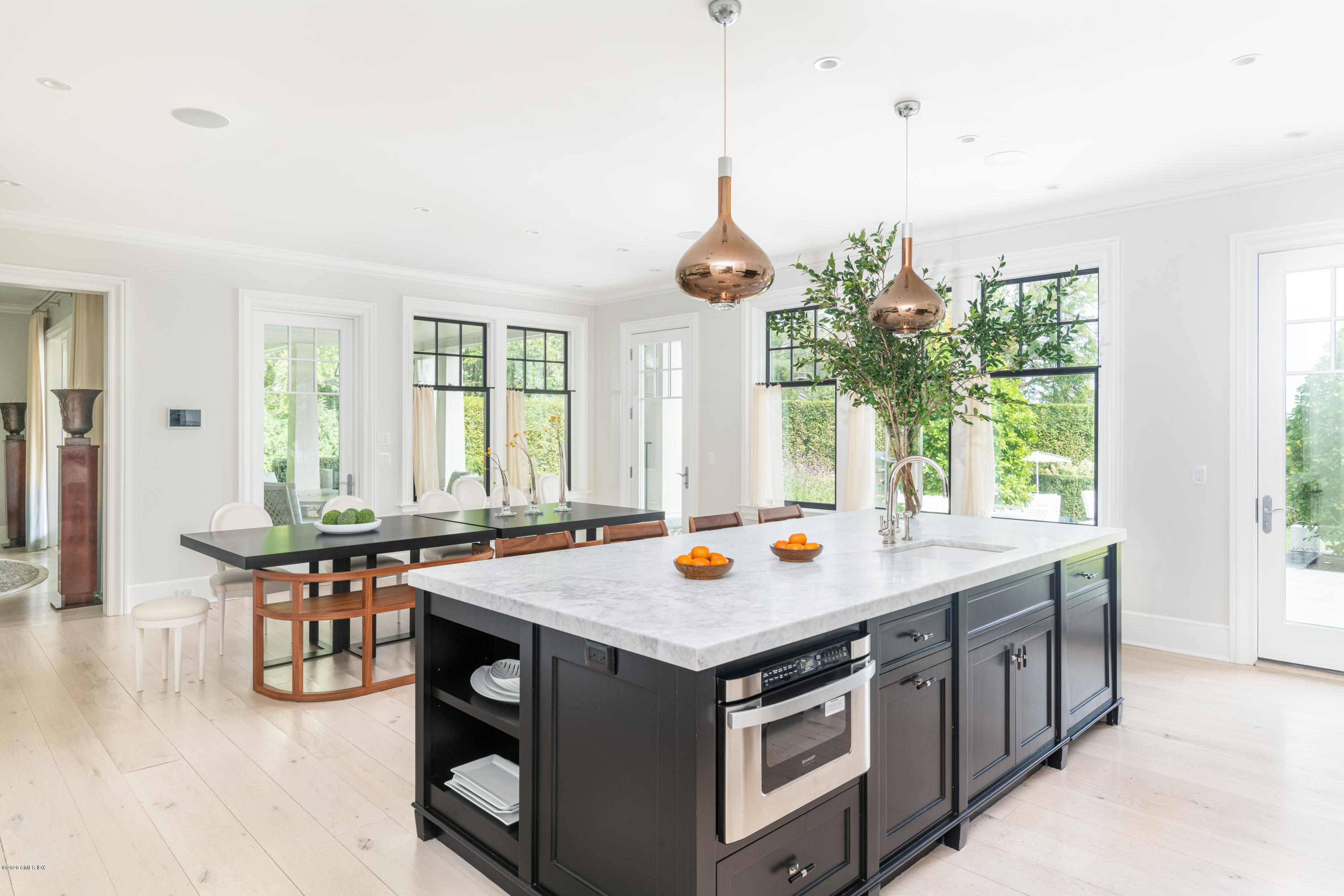 Undisclosed Address Greenwich, CT 06830 - Photo 7 of 30 a open kitchen with stainless steel appliances granite countertop a stove and a table