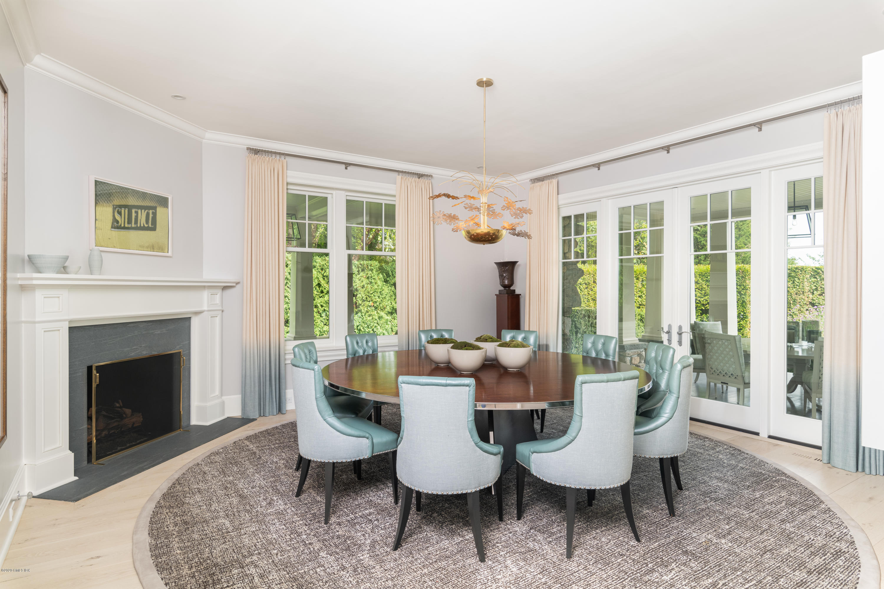 Undisclosed Address Greenwich, CT 06830 - Photo 8 of 30 a living room with furniture and a fireplace