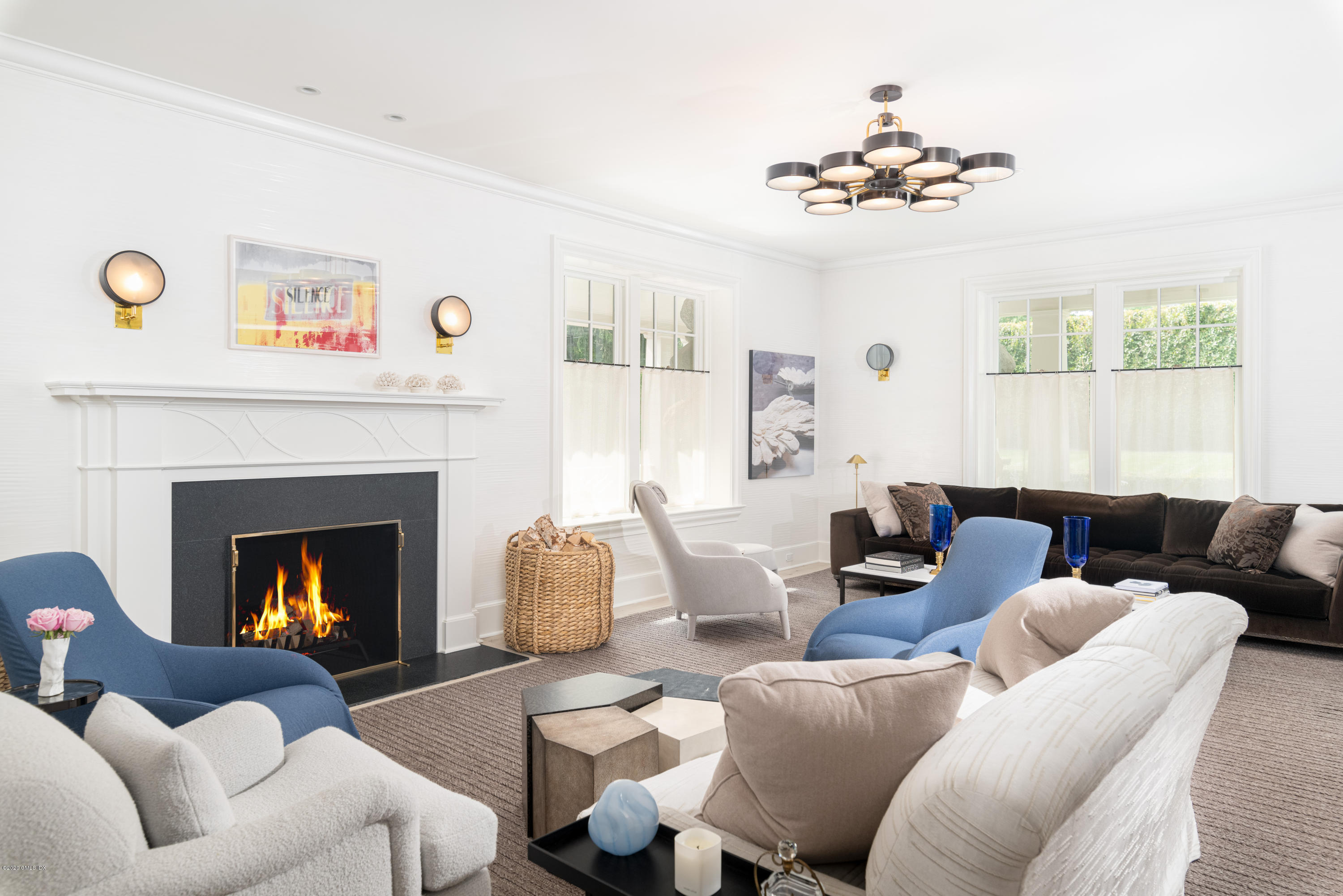 Undisclosed Address Greenwich, CT 06830 - Photo 10 of 30 a living room with furniture and a fireplace