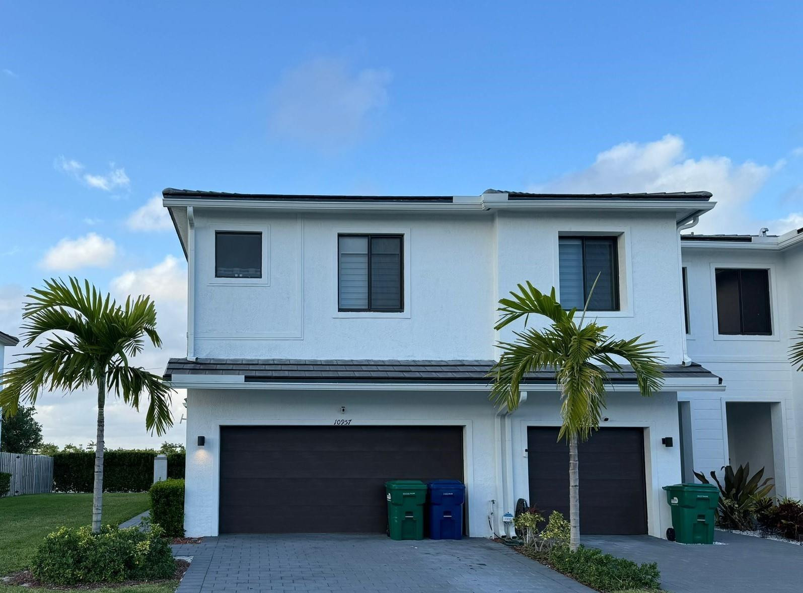 10957 Southwest 232nd Terrace Homestead, FL 33032 - Photo 11 of 11 a house with a palm tree in front of it