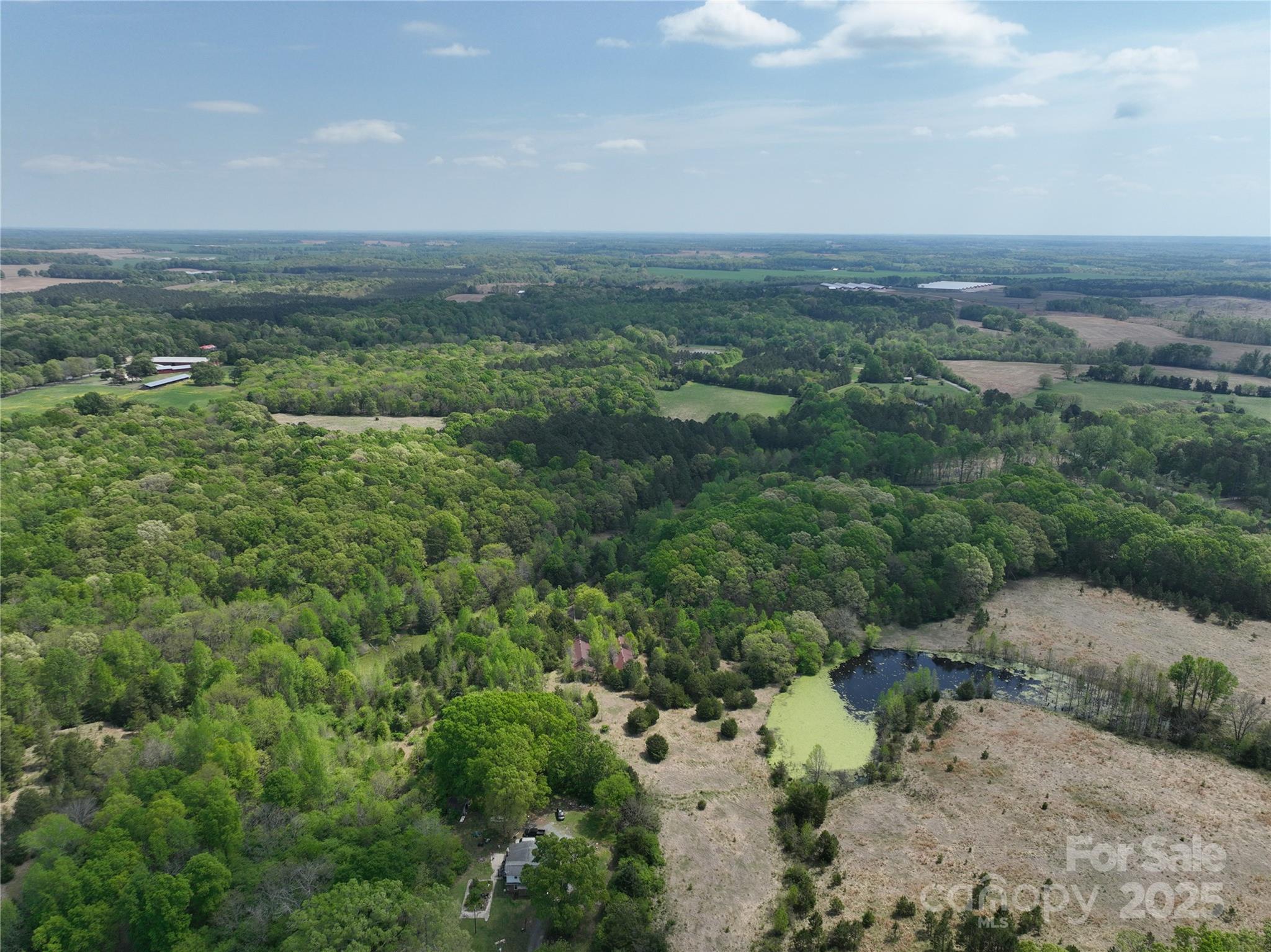 1720 Trinity Church Road Monroe, NC 28112 - Photo 2 of 8 an aerial view of a city with lots of residential buildings