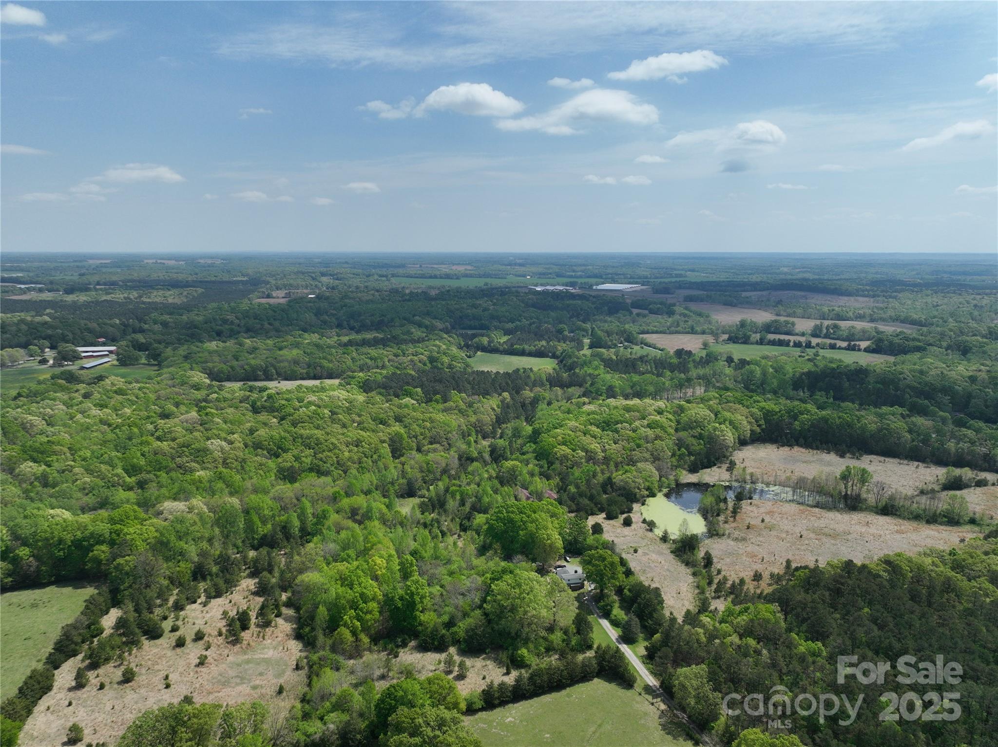1720 Trinity Church Road Monroe, NC 28112 - Photo 6 of 8 a view of a city with lush green forest