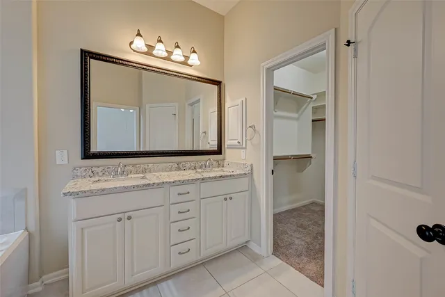 a view of an empty room and closet area