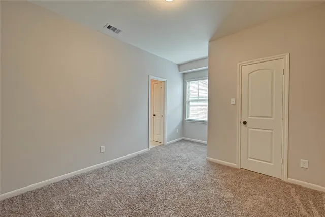 a view of a livingroom with a ceiling fan and window