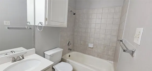 a bathroom with a toilet sink and bathtub