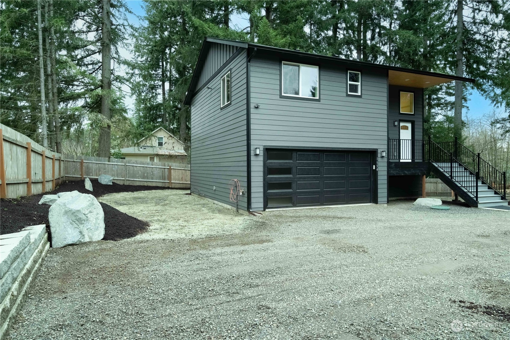 a front view of a house with garage