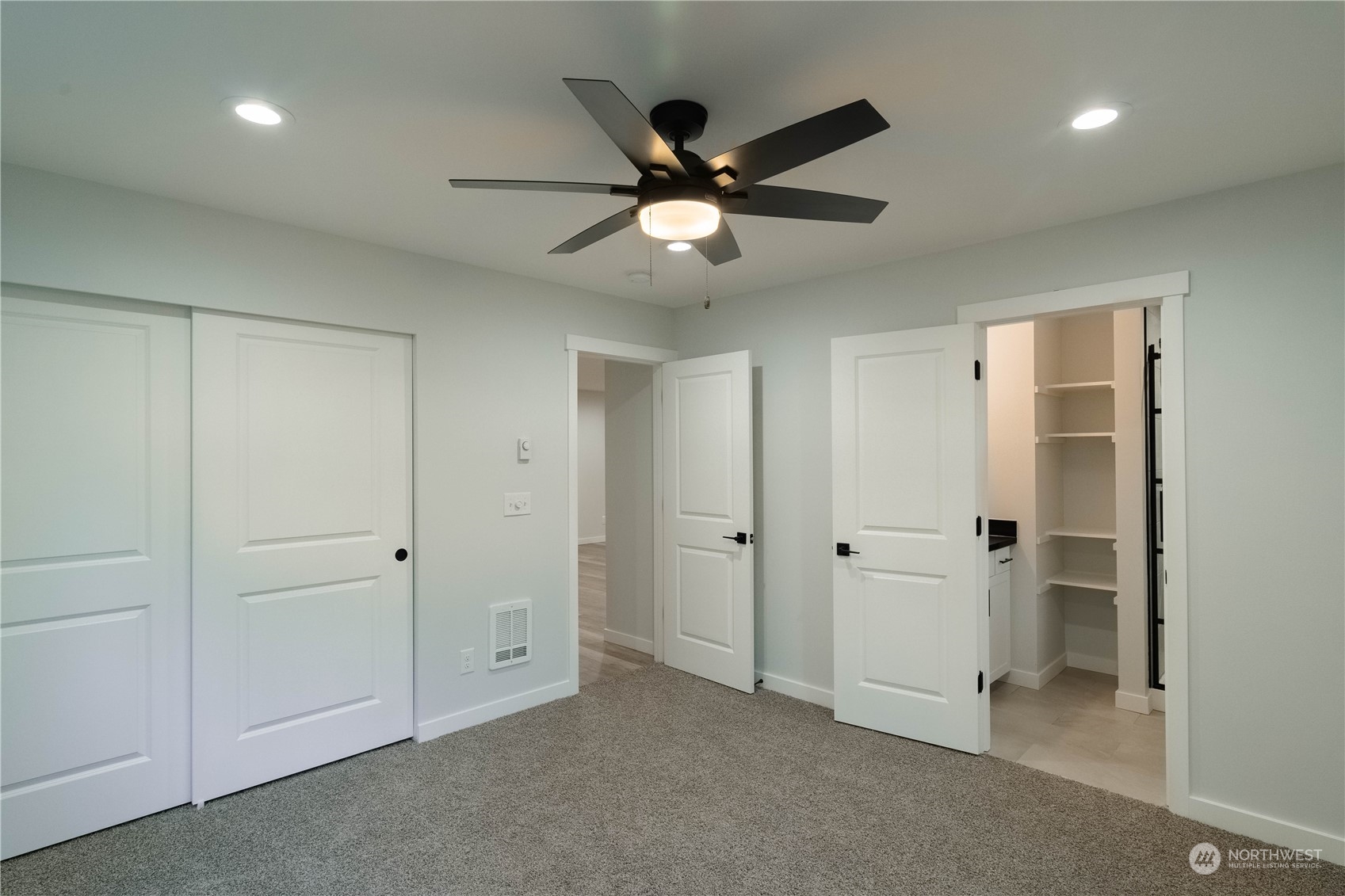 1654 Baby Doll Road Southeast Port Orchard, WA 98366 - Photo 11 of 30 an empty room with closet and a chandelier fan