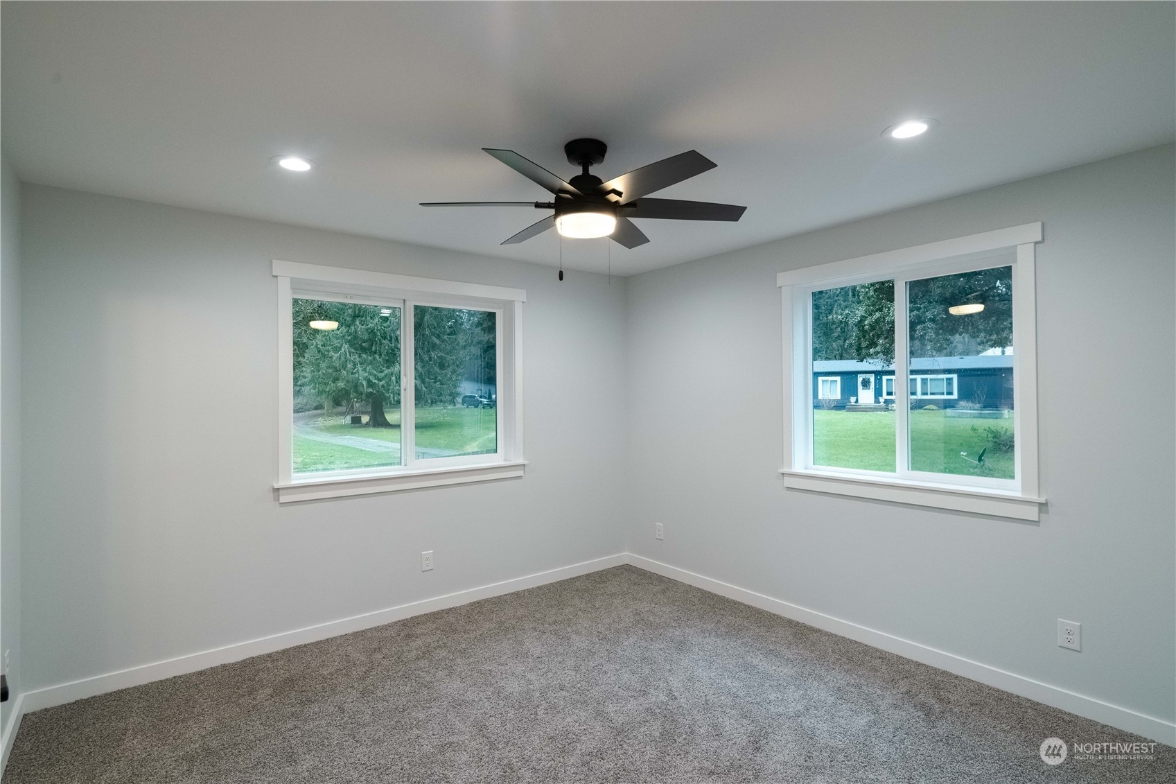 1654 Baby Doll Road Southeast Port Orchard, WA 98366 - Photo 12 of 30 an empty room with a window and a fan