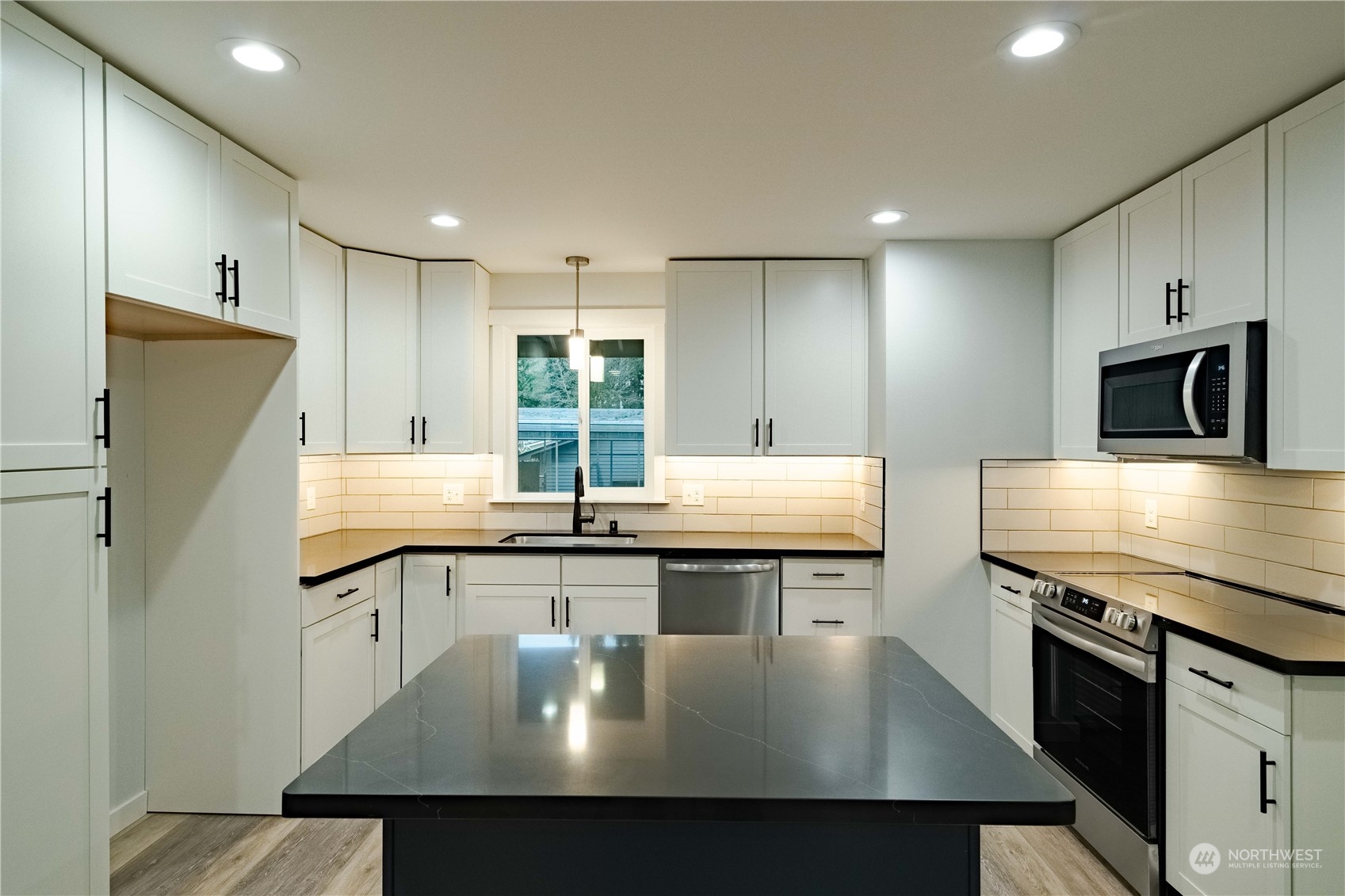 1654 Baby Doll Road Southeast Port Orchard, WA 98366 - Photo 2 of 30 a kitchen with stainless steel appliances granite countertop a sink a stove and a refrigerator