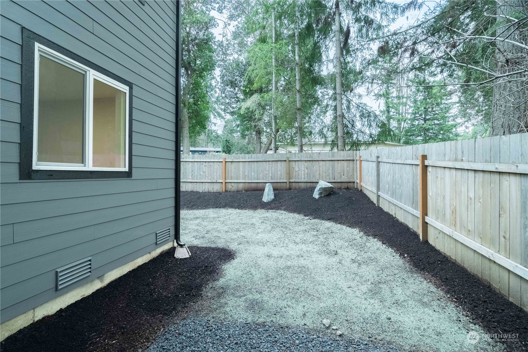 1654 Baby Doll Road Southeast Port Orchard, WA 98366 - Photo 23 of 30 a view of a backyard with trees