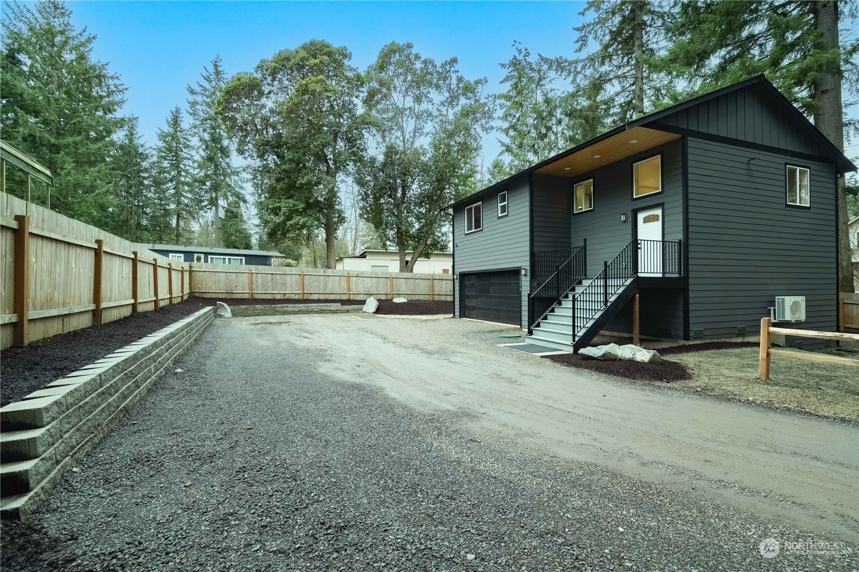 1654 Baby Doll Road Southeast Port Orchard, WA 98366 - Photo 24 of 30 a view of a house with backyard and trees
