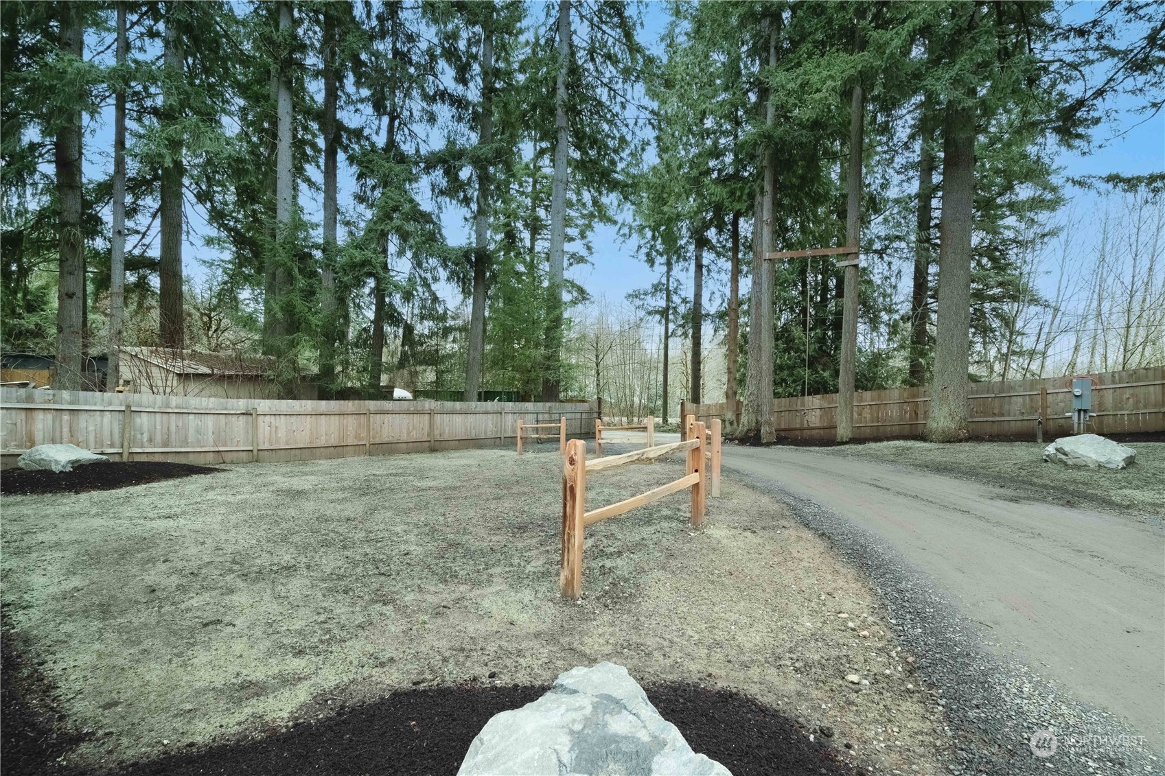 1654 Baby Doll Road Southeast Port Orchard, WA 98366 - Photo 27 of 30 a backyard of a house with lots of green space