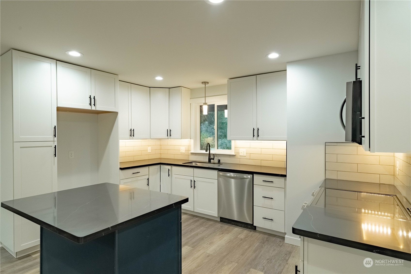 1654 Baby Doll Road Southeast Port Orchard, WA 98366 - Photo 5 of 30 a kitchen with stainless steel appliances granite countertop a sink stove and refrigerator