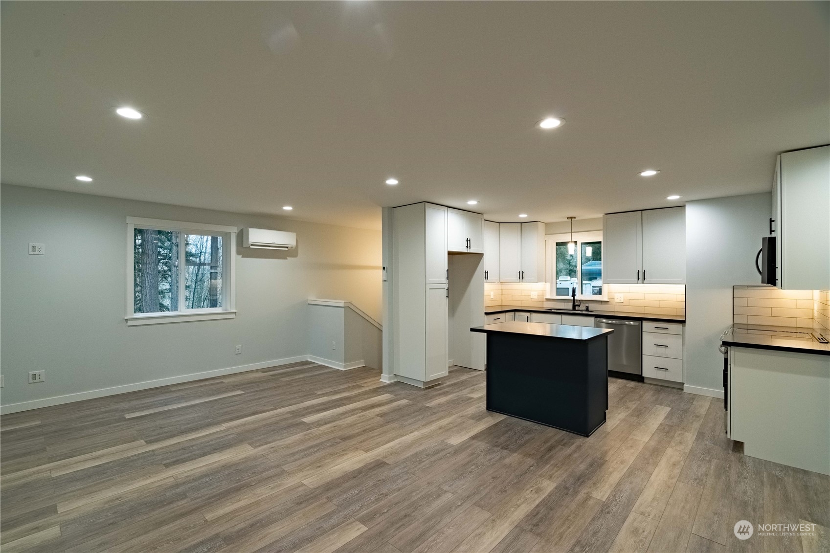 1654 Baby Doll Road Southeast Port Orchard, WA 98366 - Photo 6 of 30 a kitchen with kitchen island sink and center island