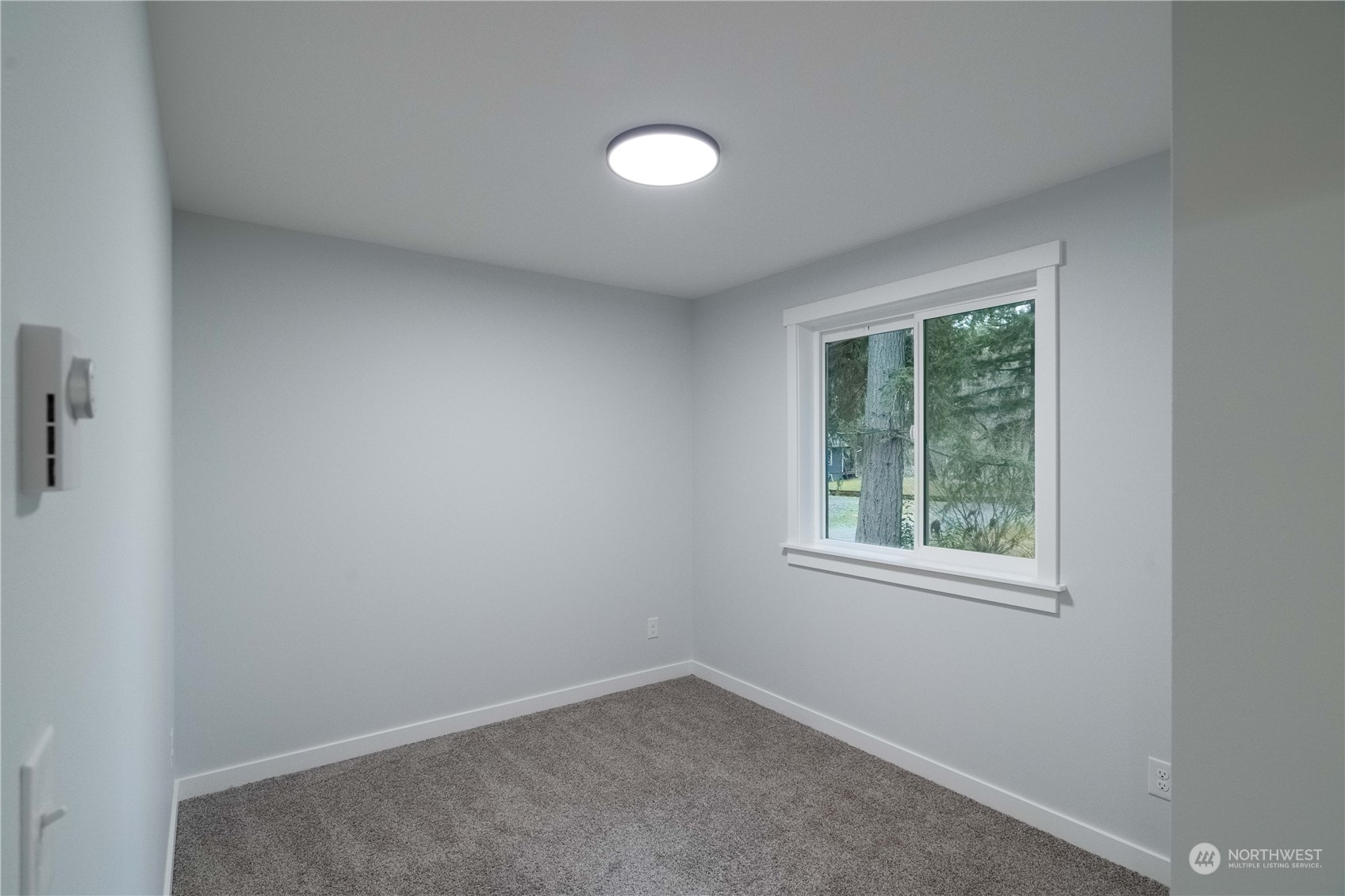 1654 Baby Doll Road Southeast Port Orchard, WA 98366 - Photo 10 of 30 an empty room with a window