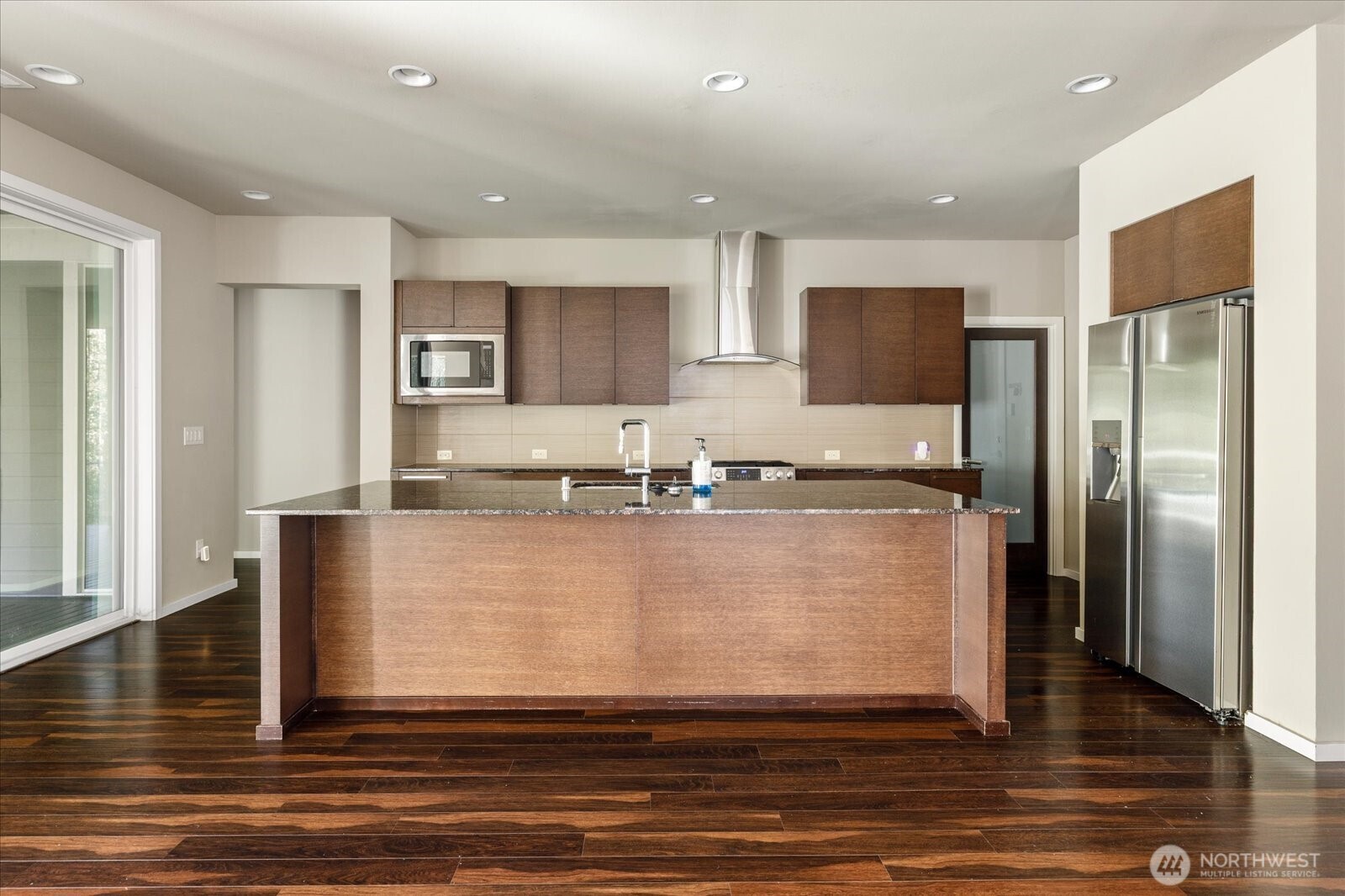 3701 170th Place Southeast Bothell, WA 98012 - Photo 12 of 37 a large kitchen with stainless steel appliances granite countertop a refrigerator a stove and a sink