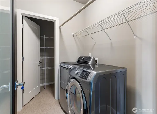 a view of storage and utility room with washer and dryer