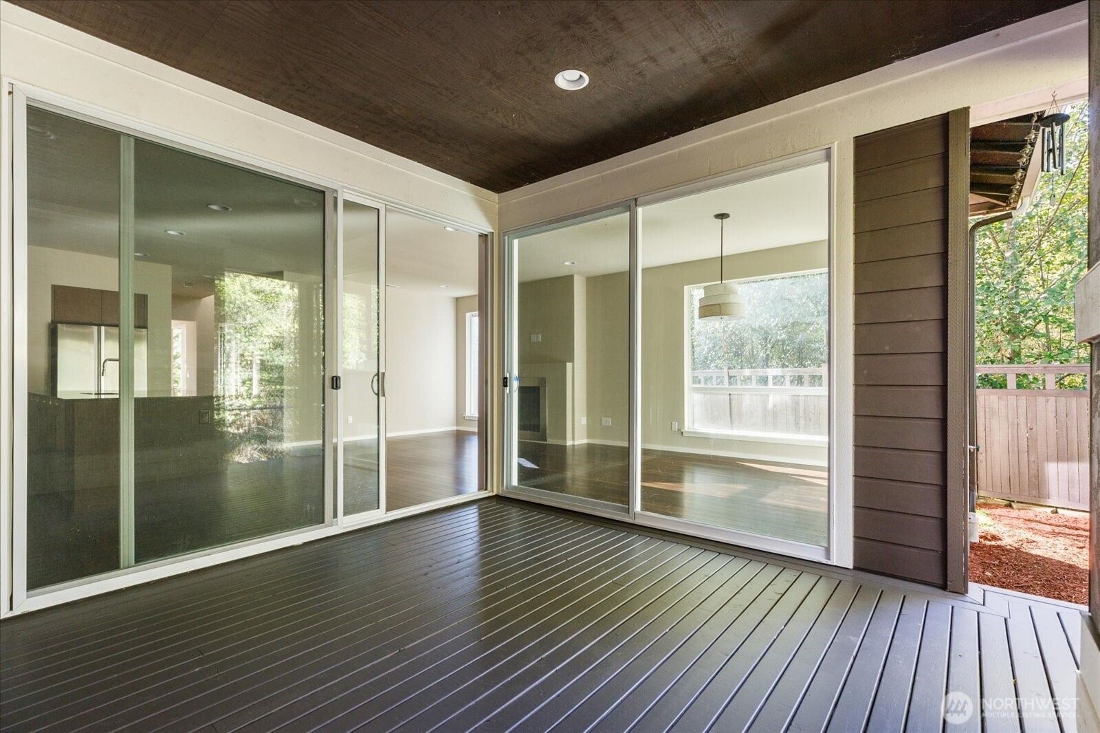 3701 170th Place Southeast Bothell, WA 98012 - Photo 18 of 37 a view of wooden floor in an empty room with glass door