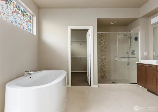 a bathroom with a bathtub and shower