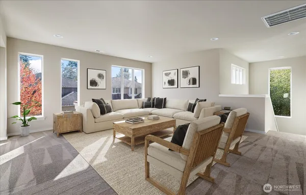 a living room with furniture and windows