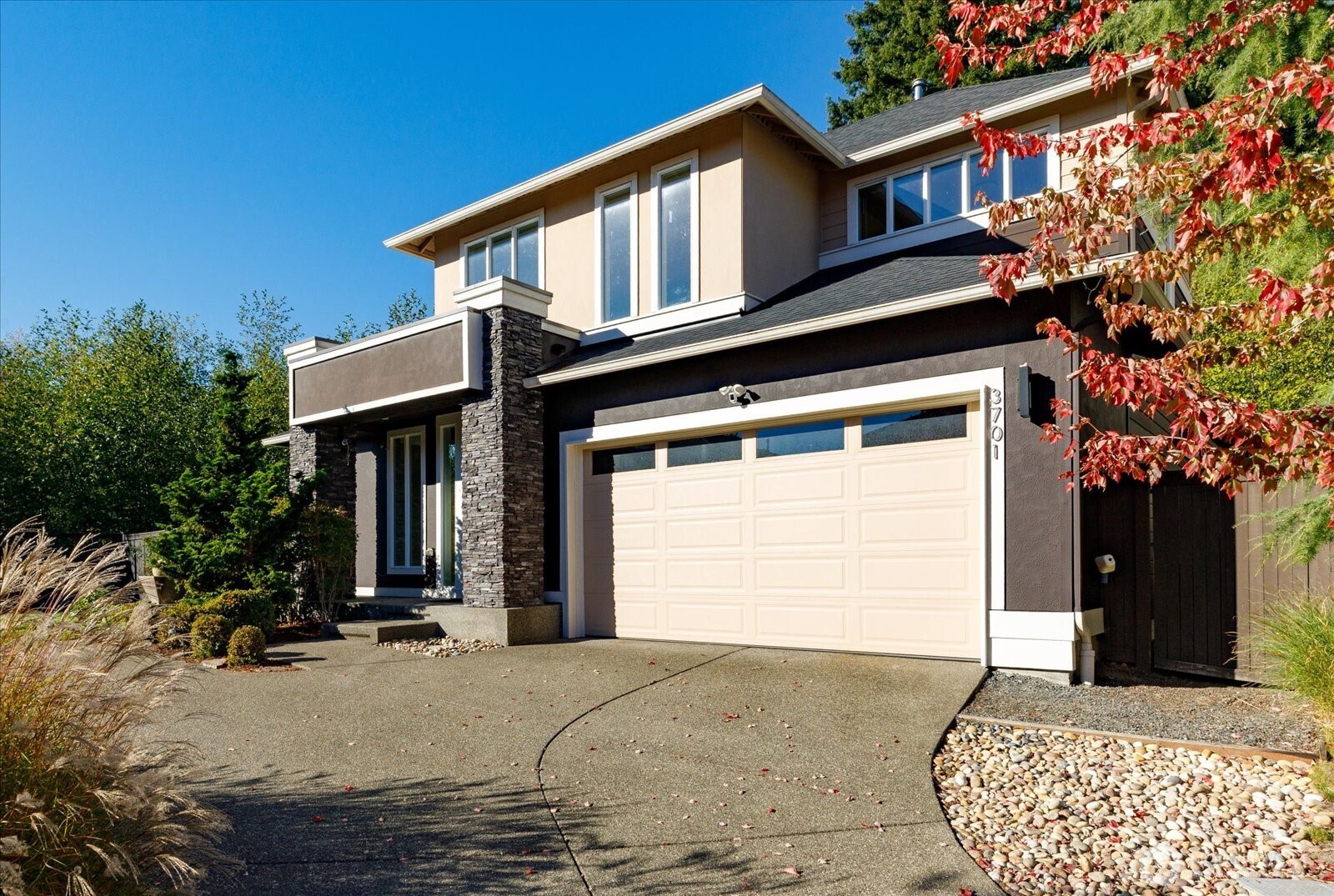 3701 170th Place Southeast Bothell, WA 98012 - Photo 34 of 37 a front view of a house with a yard and garage