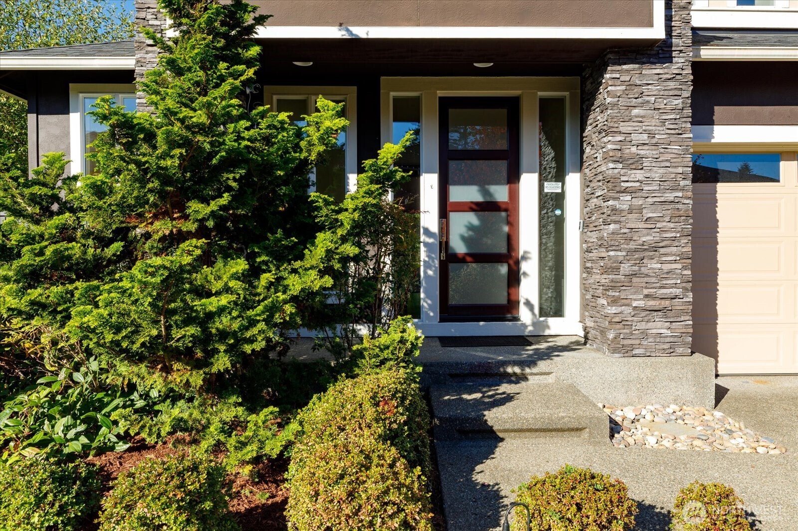 3701 170th Place Southeast Bothell, WA 98012 - Photo 4 of 37 a front view of a house with a yard