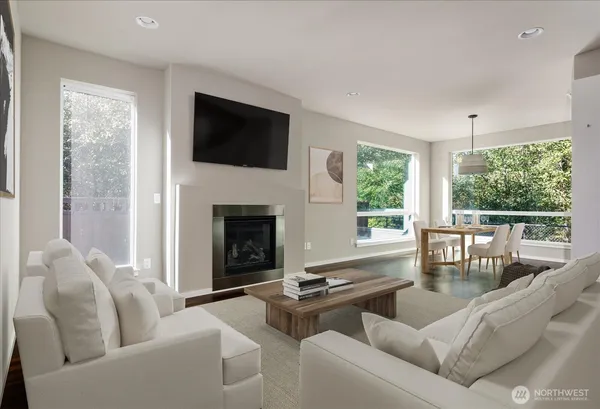 a living room with furniture fireplace and window