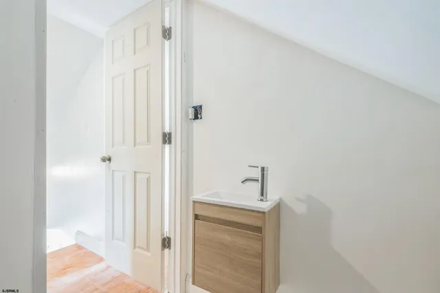 a bathroom with a bathtub and shower