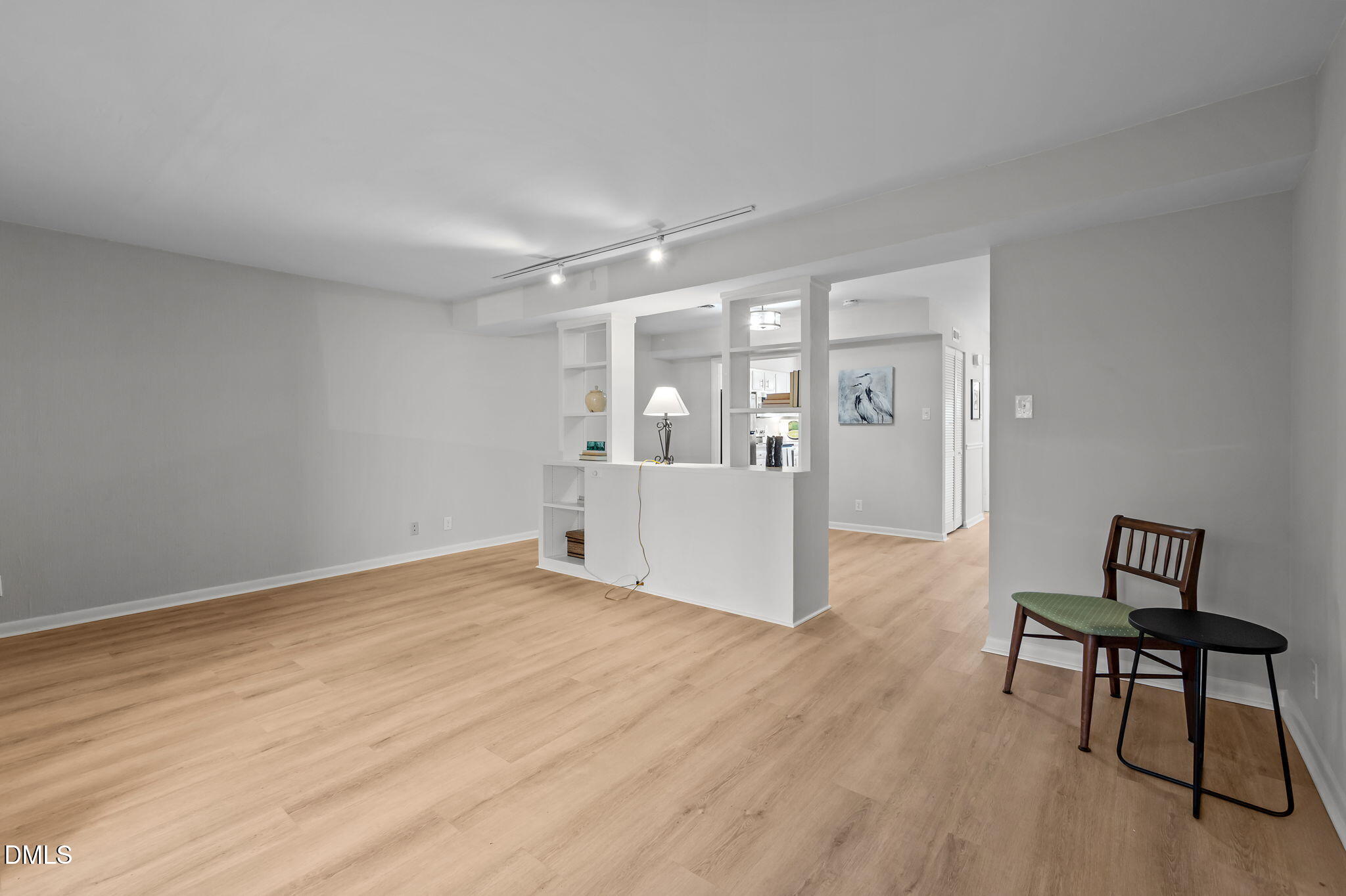 3080 Colony Road, Unit 3080C Durham, NC 27705 - Photo 12 of 57 a view of an empty room with wooden floor and a window