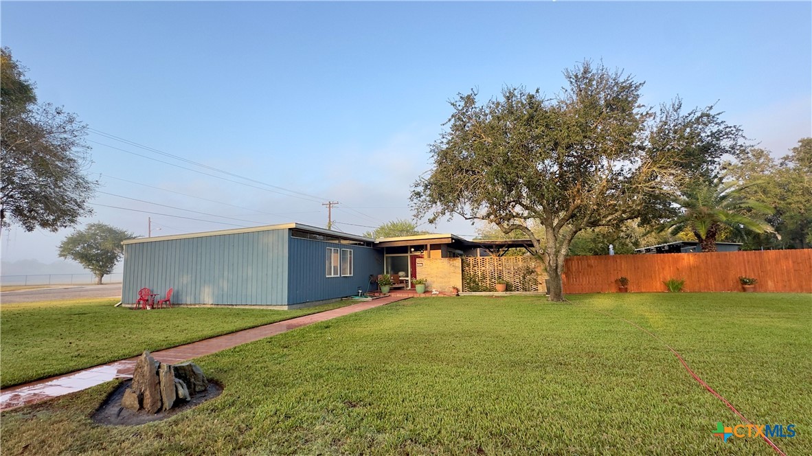 601 Lawrence Street Refugio, TX 78377 - Photo 2 of 42 a house with garden in front of it