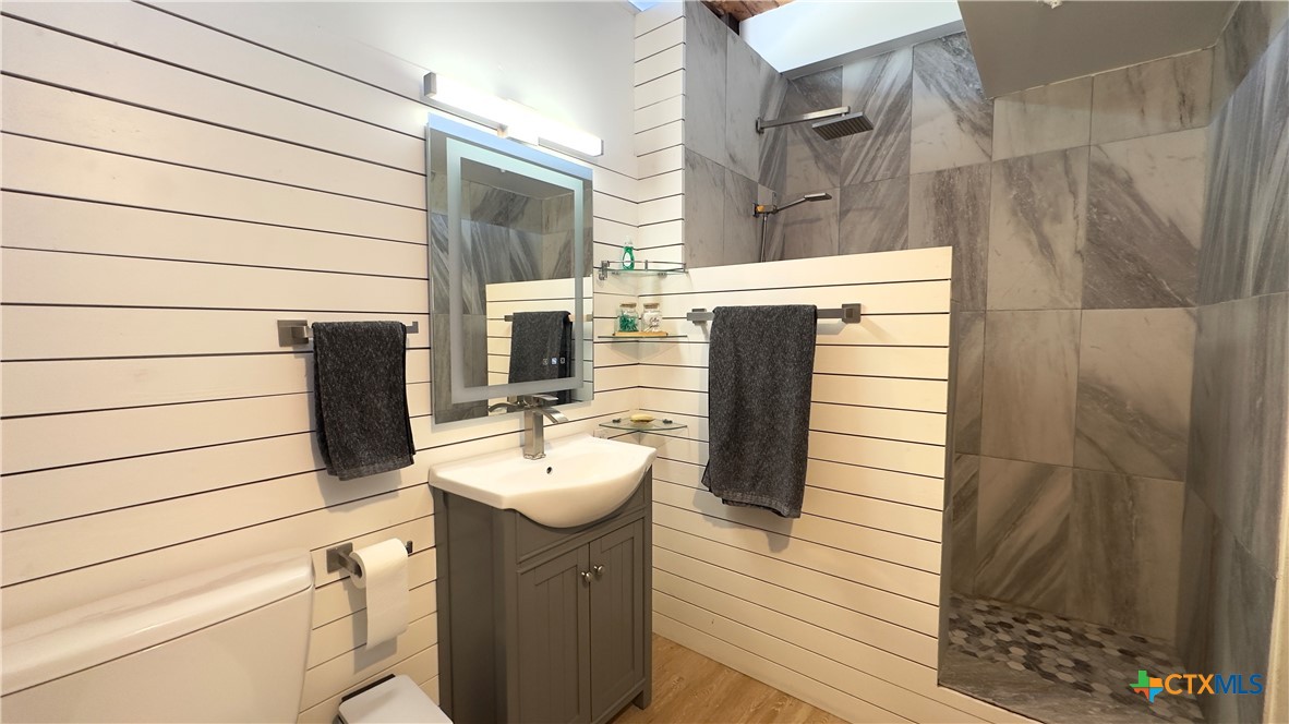 601 Lawrence Street Refugio, TX 78377 - Photo 24 of 42 a bathroom with a sink and mirror