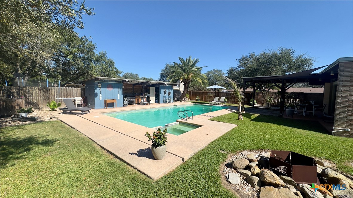 601 Lawrence Street Refugio, TX 78377 - Photo 32 of 42 a swimming pool with outdoor seating and yard